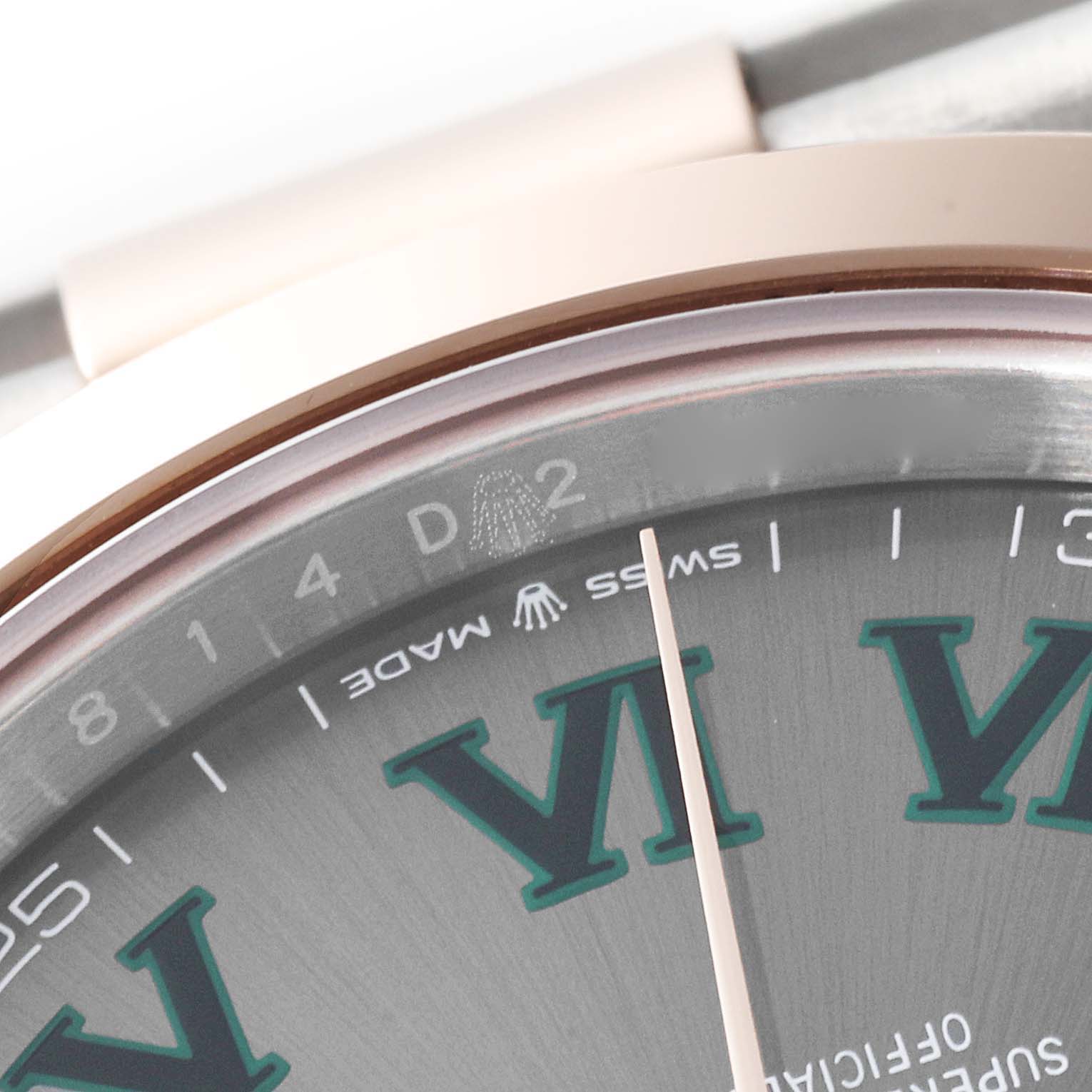 The image shows a close-up of the dial and bezel of the Rolex Datejust 41 126301 Men's Steel and Gold (two tone) Grey Dial 126301 Men's Steel and Gold (two tone) Grey Dial, featuring Roman numerals and "Swiss Made" text.