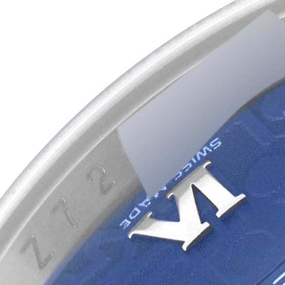 This image shows a close-up of the edge of a Rolex Datejust 116200 Men's Stainless Steel Blue Dial 116200 Men's Stainless Steel Blue Dial watch face, highlighting part of the dial and bezel.