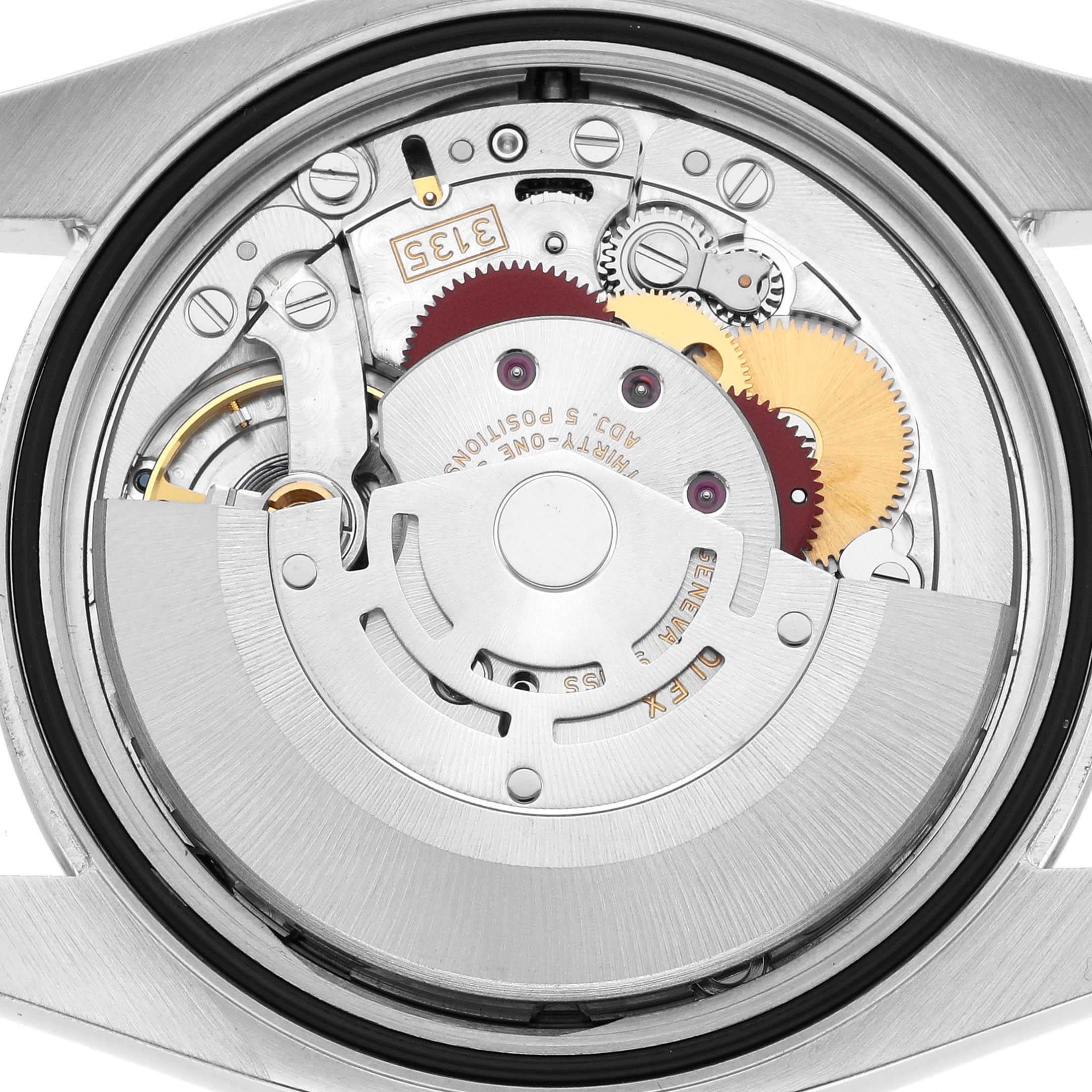 The image shows the internal movement and rotor of a Rolex Datejust 116200 Men
s Stainless Steel Blue Dial watch from a back view.