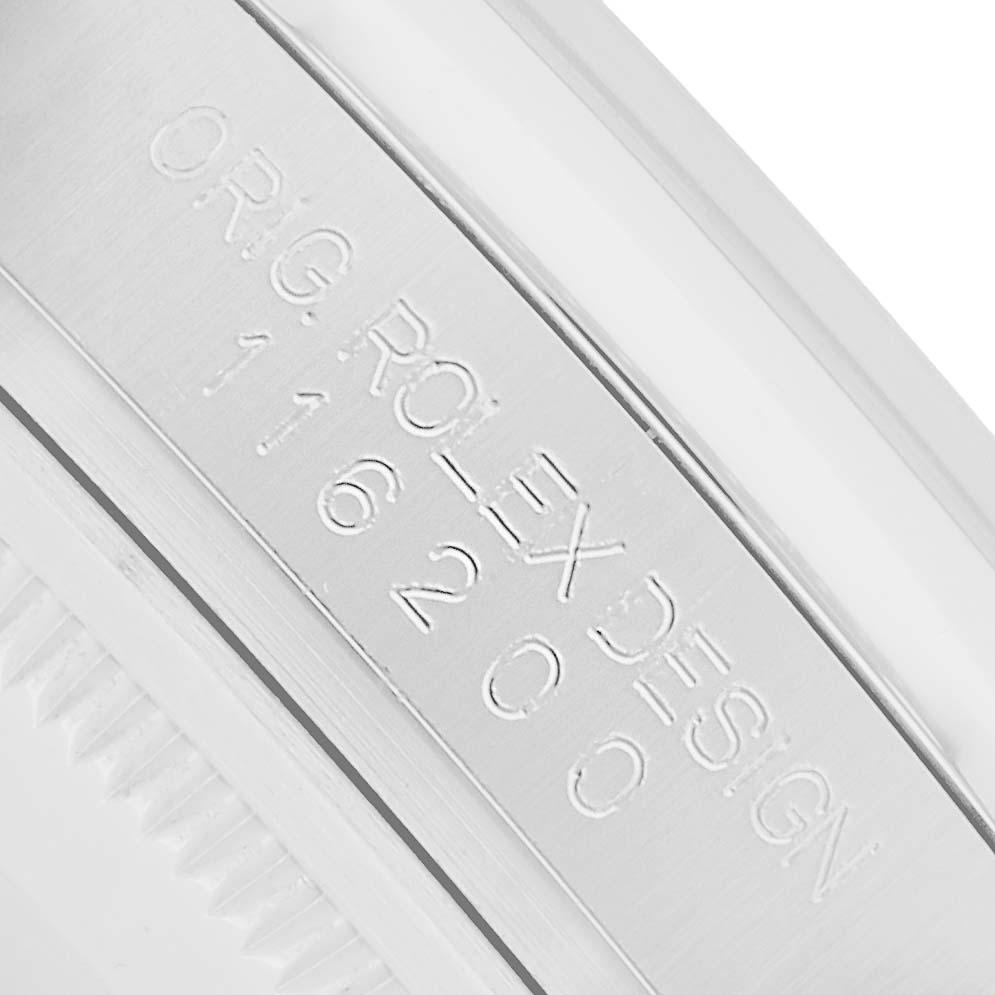 The image shows a close-up of the model number engraved on the side of a Rolex Datejust 116200 Men
s Stainless Steel Blue Dial watch case.