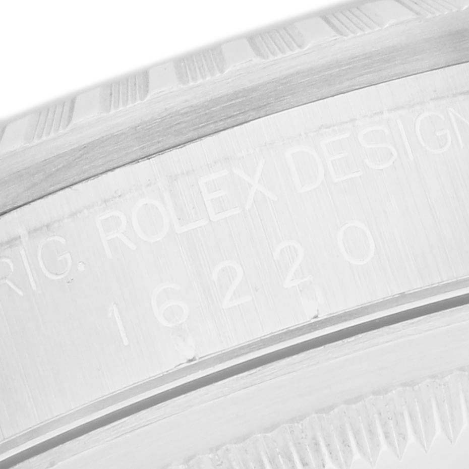 The image shows a close-up of the engraved side of a Rolex Datejust 16220 Men
s Stainless Steel Black Dial watch bezel or inner ring.