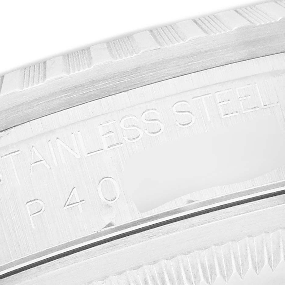 The image shows a close-up of the engraved stainless steel case back of a Rolex Datejust 16220 Men
s Stainless Steel Black Dial watch.