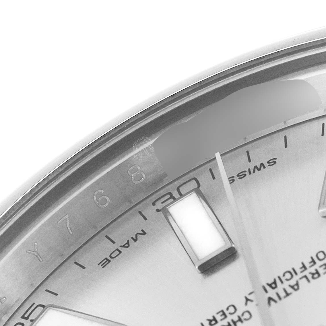 This image shows a close-up, partial view of the dial and inner bezel with serial engraving of the Rolex Datejust 41 116300 Men
s Stainless Steel Silver Dial 116300 Men
s Stainless Steel Silver Dial watch.