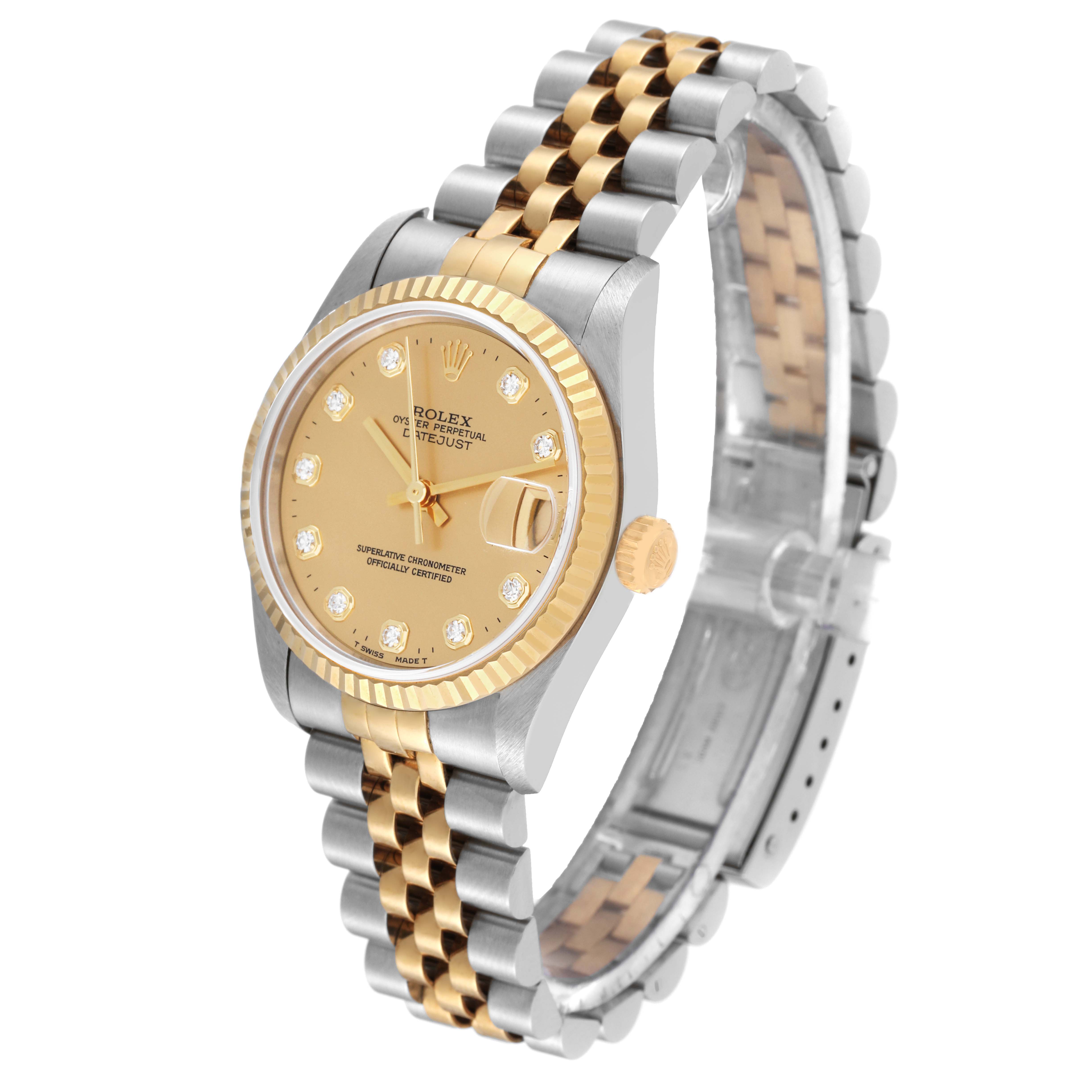The image shows a side angle of the Mid-Size Rolex watch, highlighting the gold and silver bracelet, gold crown, and champagne dial.