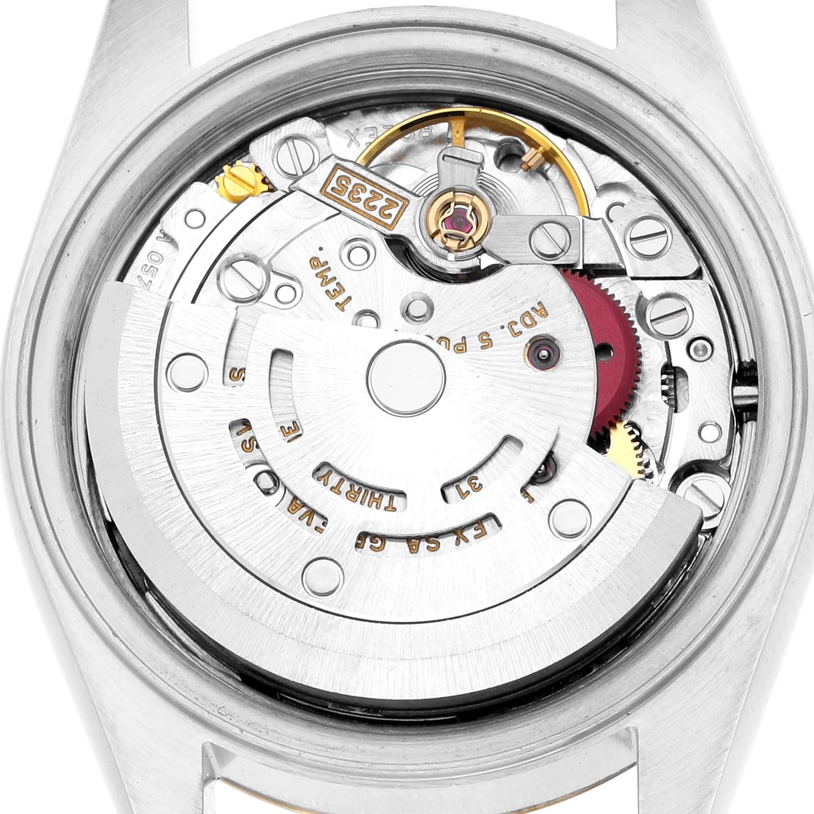 The image shows the movement of a Rolex Datejust 79173 Women
s Steel and Gold (two tone) Silver Dial watch from a top-down angle, focusing on the rotor and internal components.