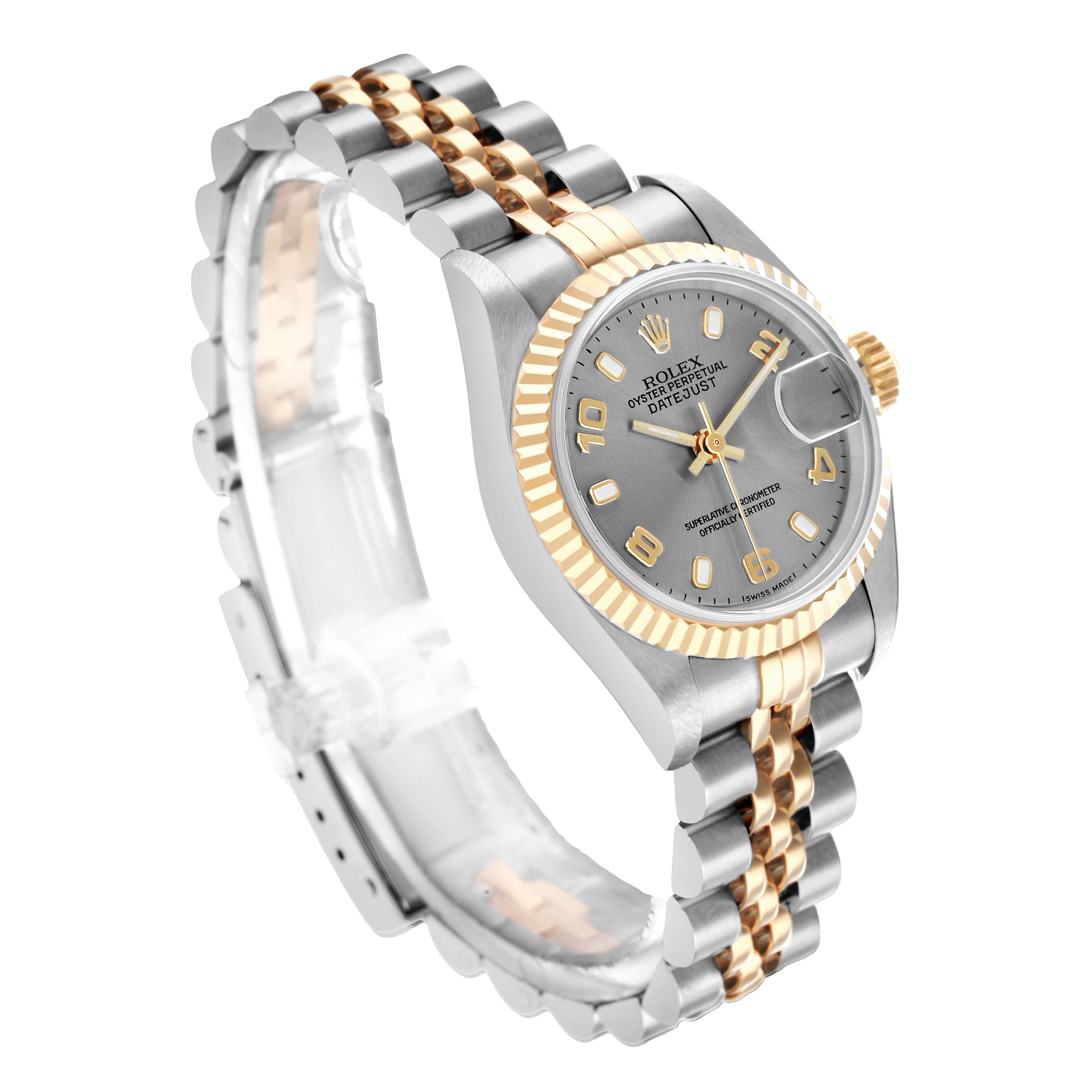 The Rolex Datejust 79173 Women
s Steel and Gold (two tone) Silver Dial is shown at a three-quarter angle, highlighting the face, bezel, crown, and two-tone bracelet.