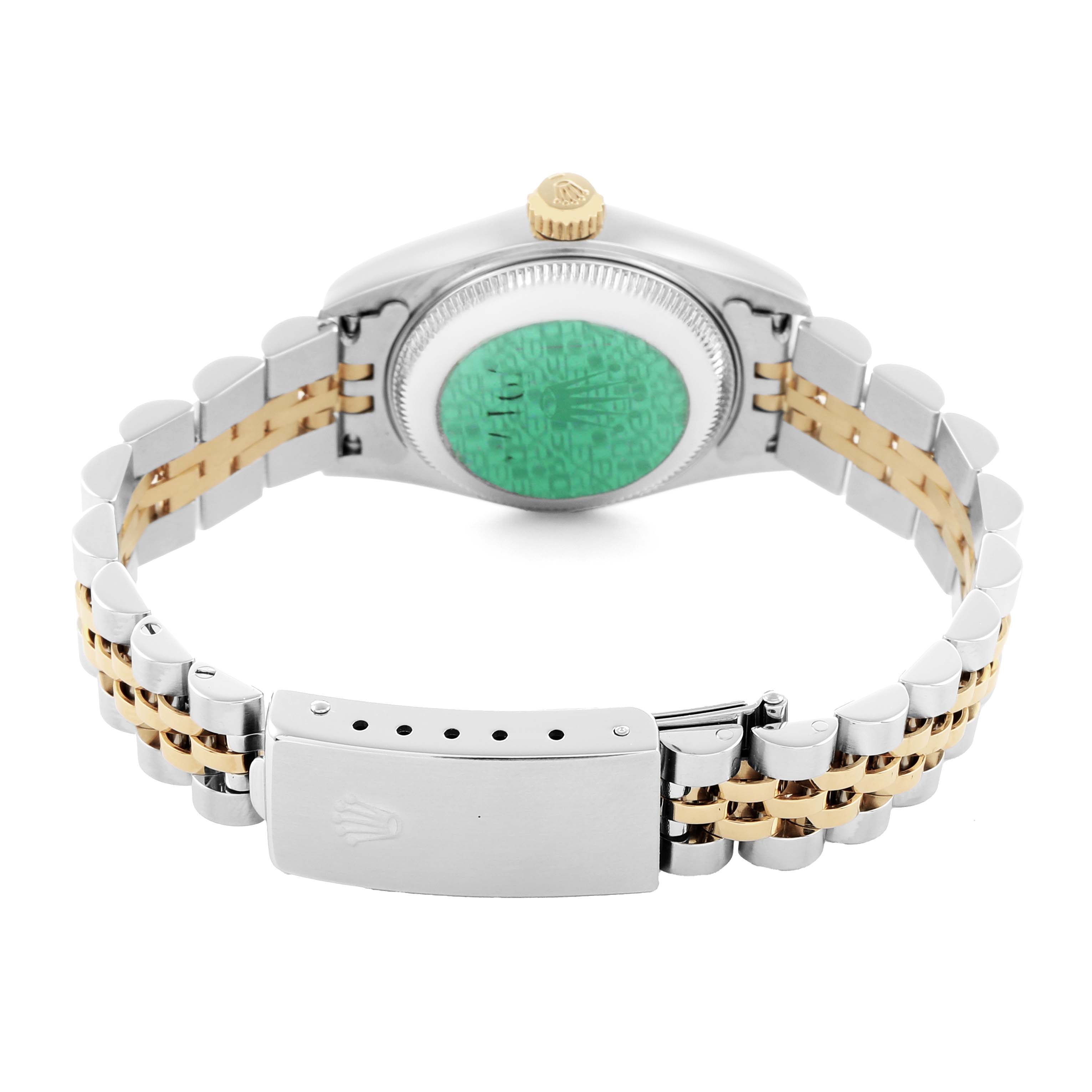 The image shows the case back, crown, and clasp of a Rolex Datejust 79173 Women
s Steel and Gold (two tone) Silver Dial, focusing on the bracelet and green sticker.