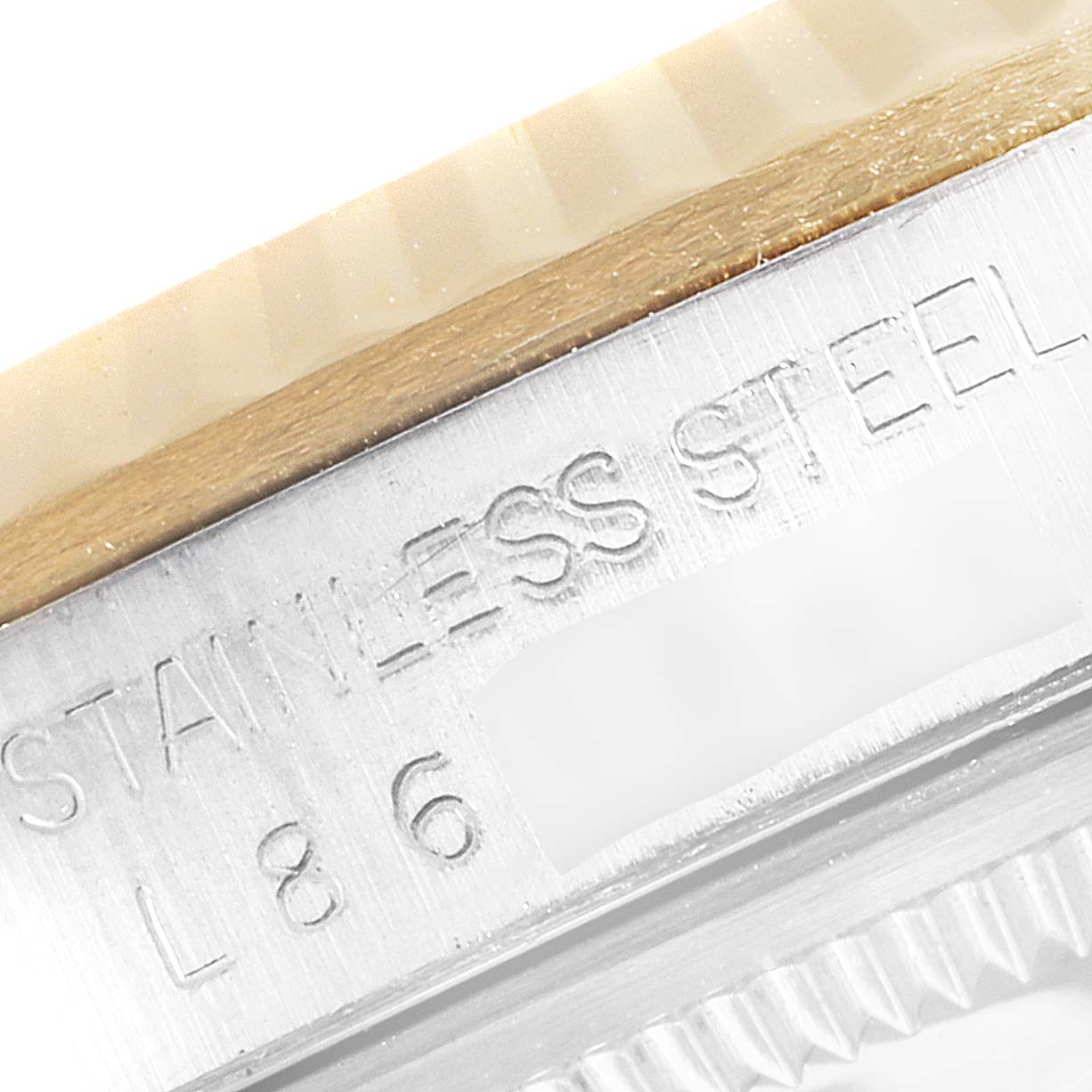 The image shows a close-up of the stainless steel casing and part of the bezel of a Rolex Datejust 16233 Men
s Steel and Gold (two tone) Champagne Dial 16233 Men
s Steel and Gold (two tone) Champagne Dial watch.