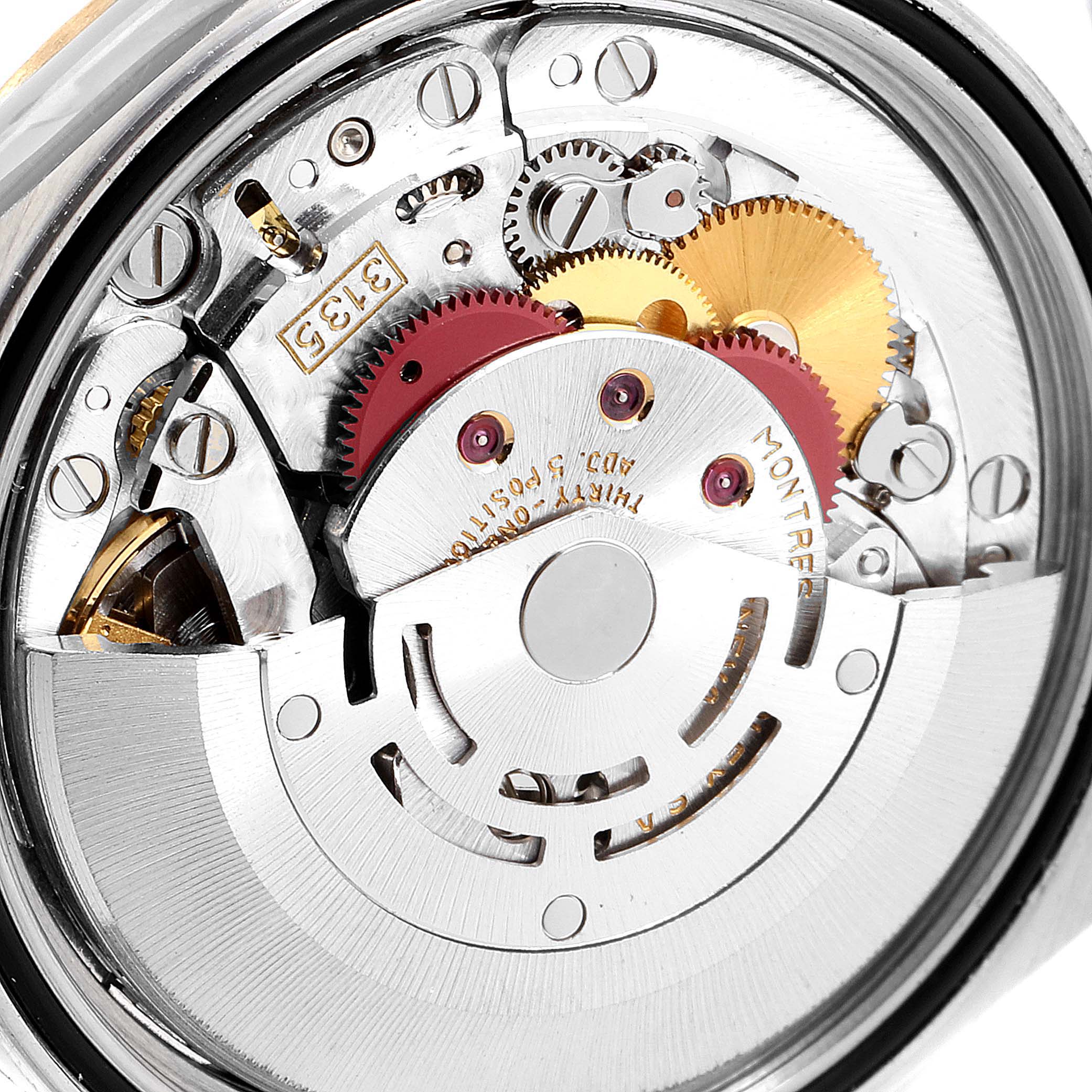 This image shows the inner mechanical movement of a Rolex Datejust 16233 Men
s Steel and Gold (two tone) Champagne Dial 16233 Men
s Steel and Gold (two tone) Champagne Dial watch at a close-up angle.
