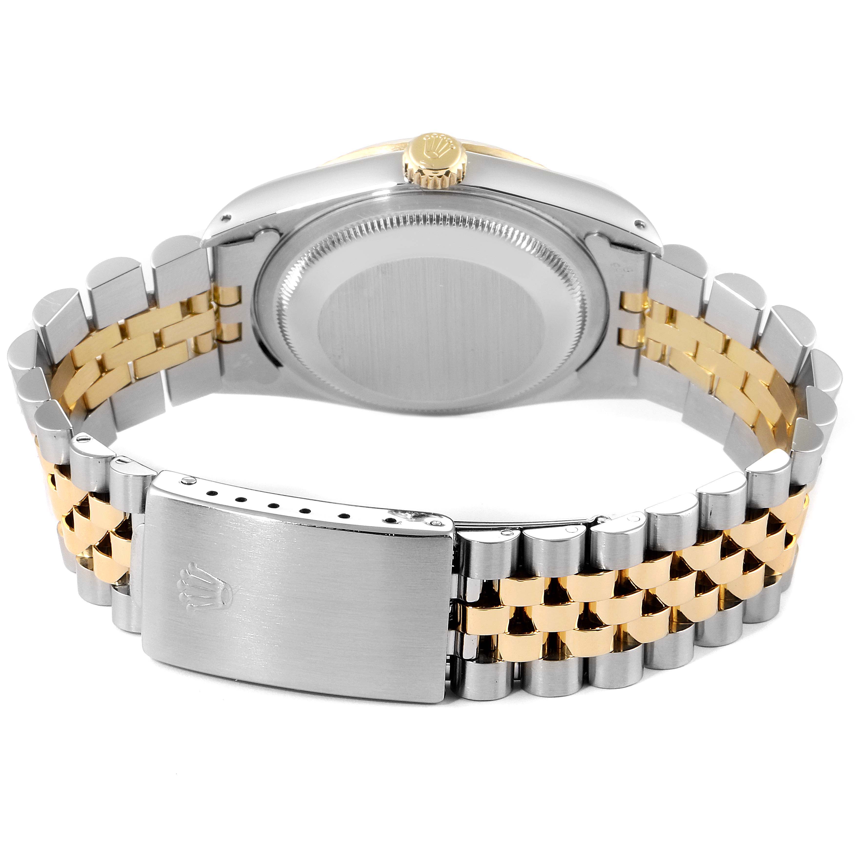 The image shows the back of the case and the clasp of a Rolex Datejust 16233 Men
s Steel and Gold (two tone) Champagne Dial 16233 Men
s Steel and Gold (two tone) Champagne Dial watch, with a two-tone jubilee bracelet.