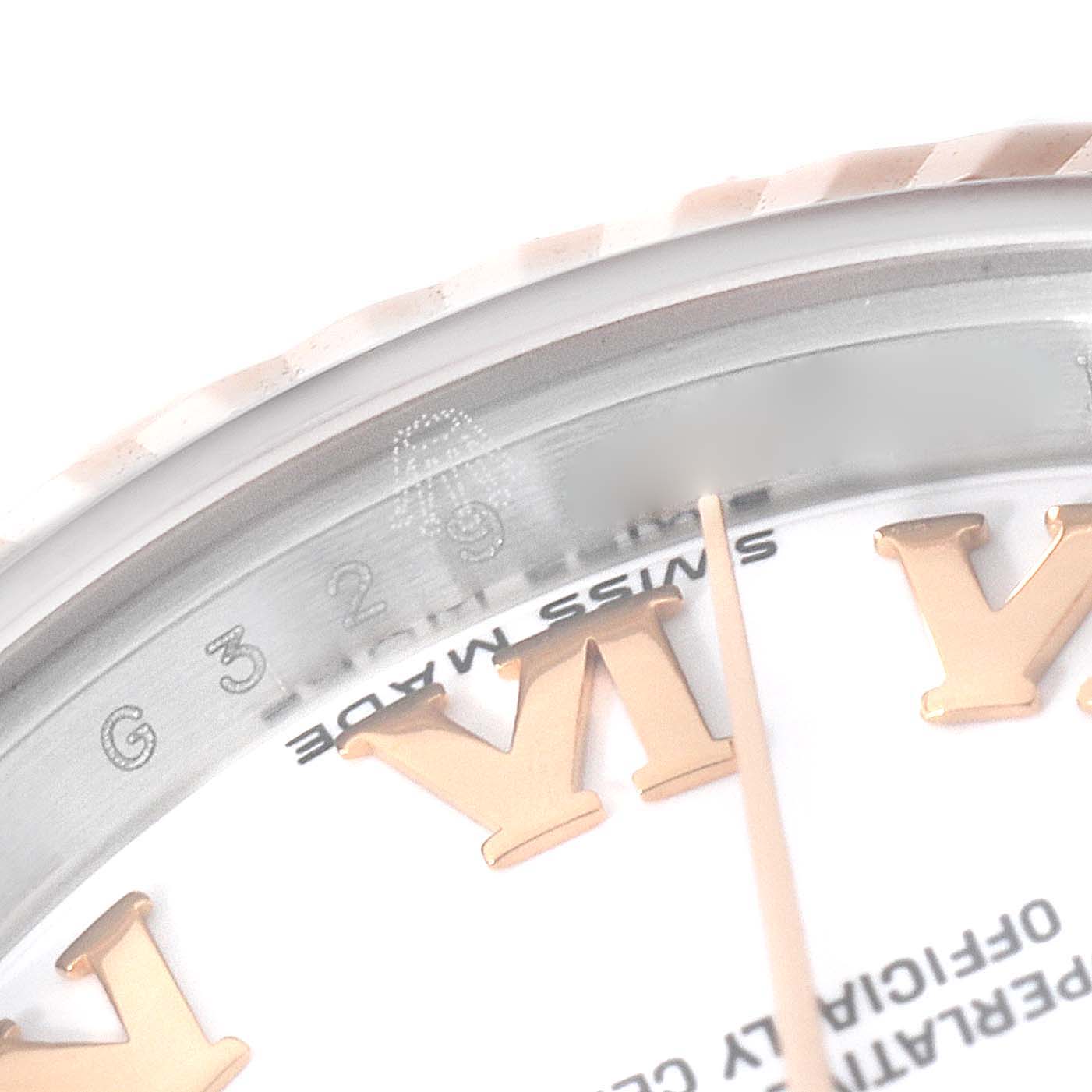 The image shows a close-up of the Datejust model by Rolex, focusing on part of the bezel, dial, and Roman numerals.