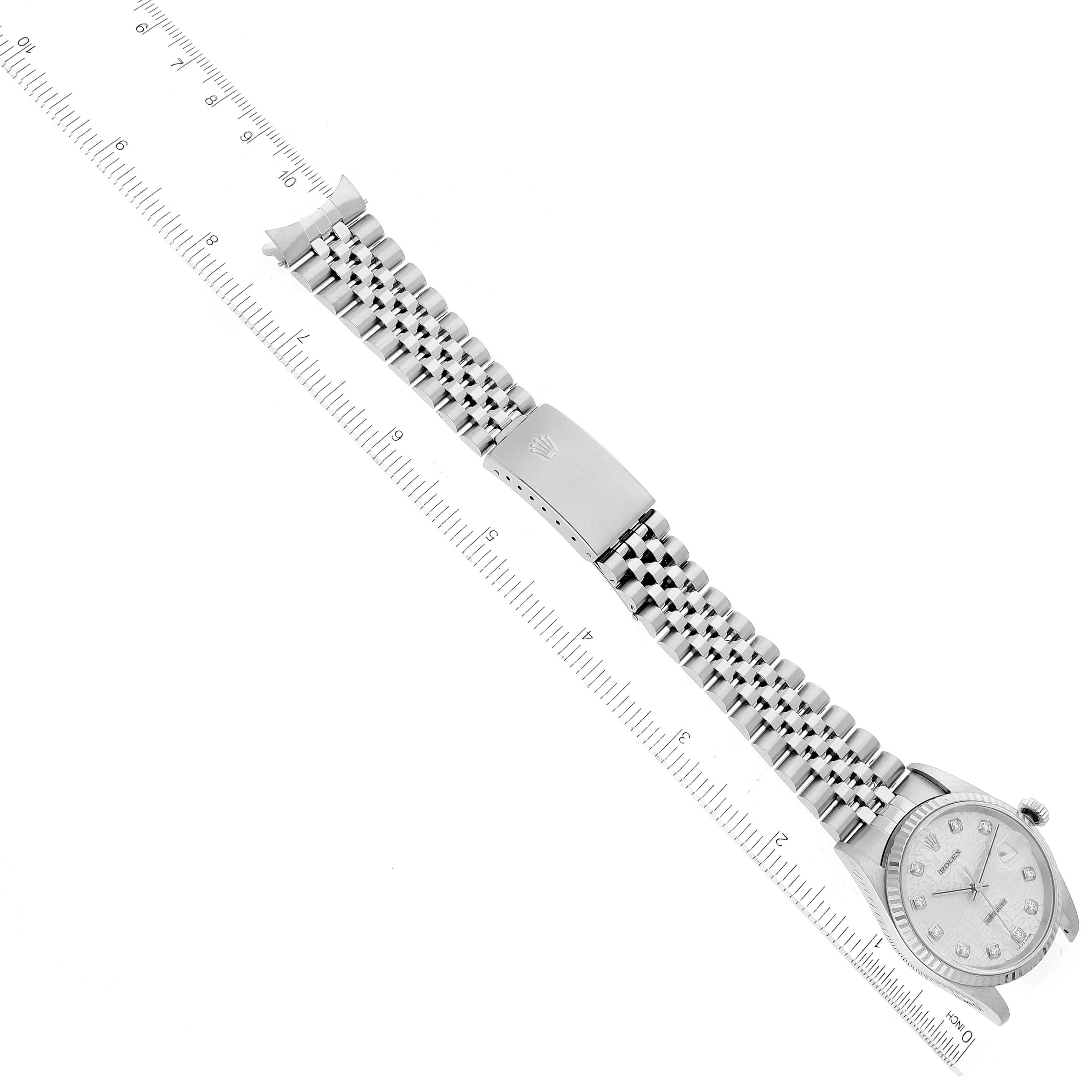 The image shows a Rolex Datejust 16234 Men's Stainless Steel Silver Dial 16234 Men's Stainless Steel Silver Dial watch lying flat, featuring the dial, bracelet, and clasp, alongside a ruler for scale.