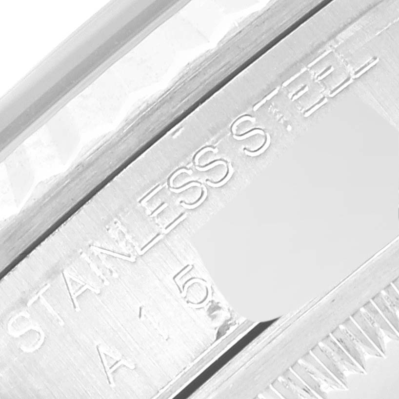 This image shows a close-up of the side of the bezel and part of the stainless steel case on a Rolex Datejust 16234 Men's Stainless Steel Pink Dial 16234 Men's Stainless Steel Pink Dial watch.