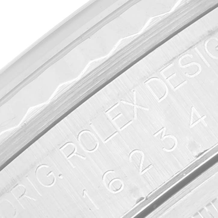 The image shows a close-up view of the side engraving on the Rolex Datejust 16234 Men's Stainless Steel Pink Dial 16234 Men's Stainless Steel Pink Dial model watch bezel.