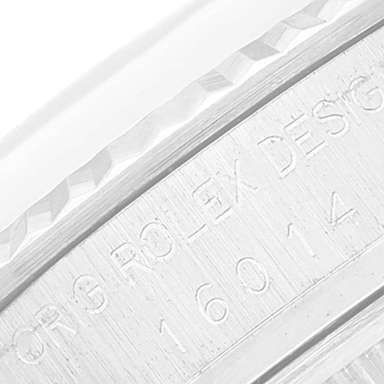 This image shows a close-up view of the case back engraving of a Rolex Vintage Collection 16014 Men's Stainless Steel Silver Dial 16014 Men's Stainless Steel Silver Dial model.
