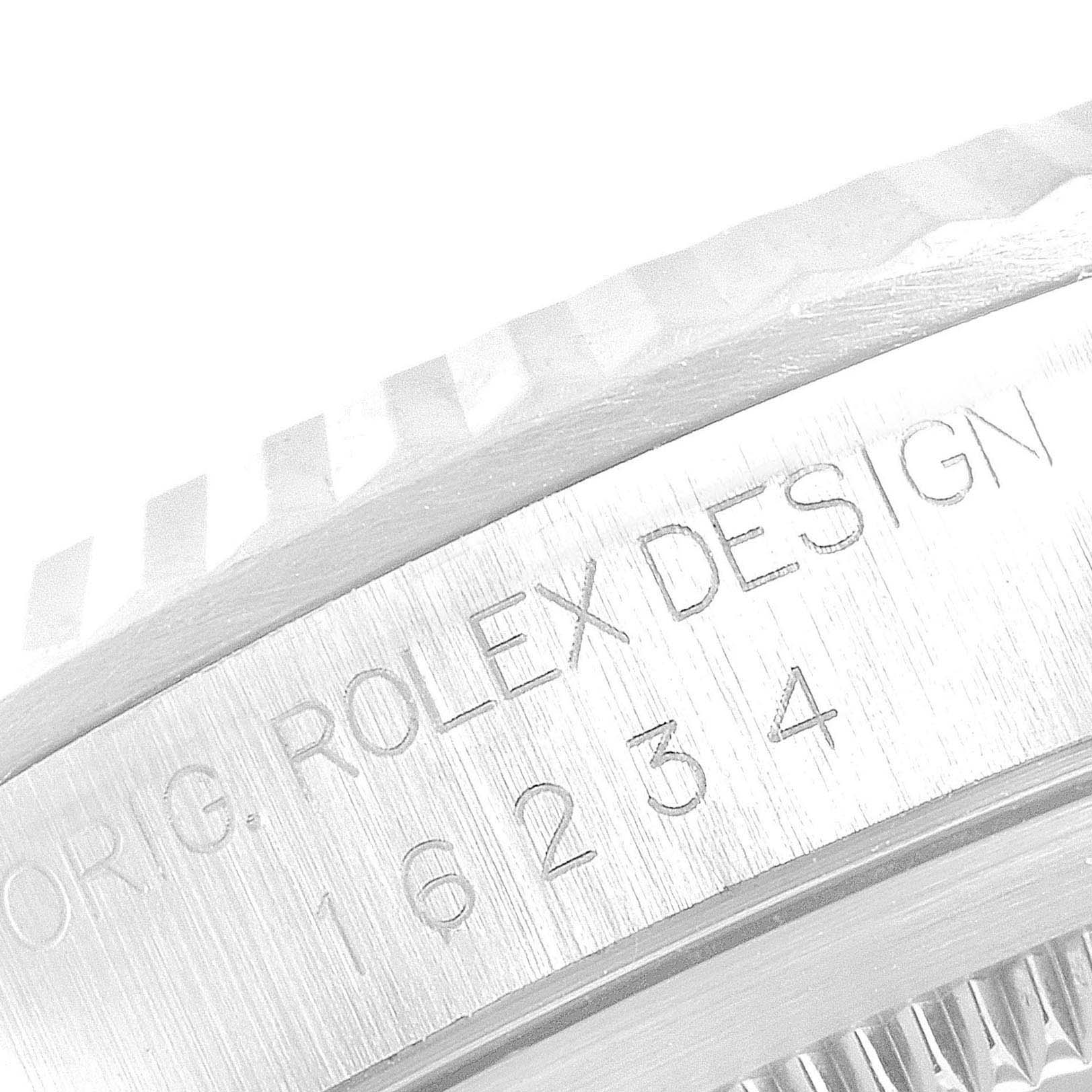 The image shows a close-up view of the case engraving on a Datejust Rolex watch.
