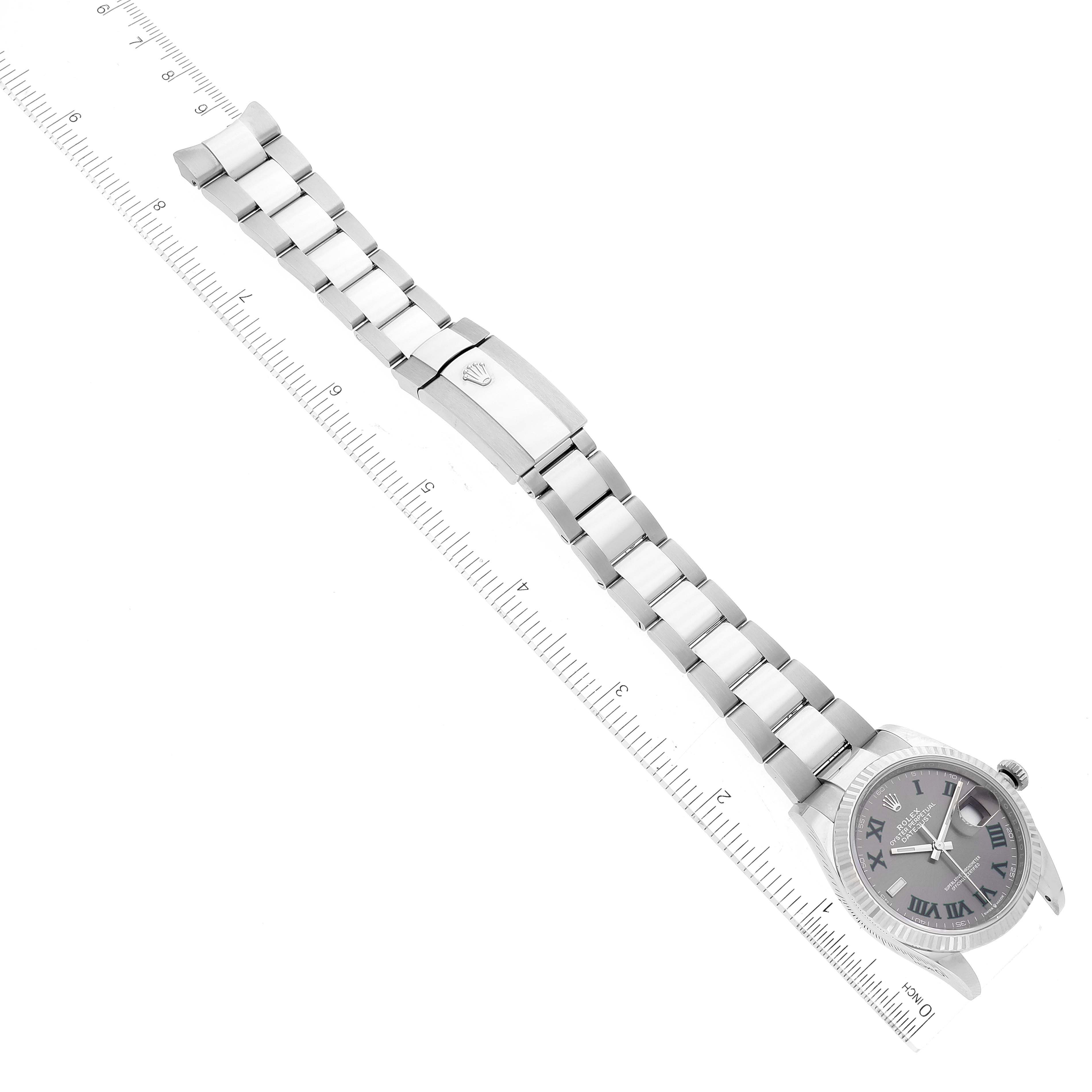 The image shows a Rolex Datejust 126234 Men's Stainless Steel Grey Dial 126234 Men's Stainless Steel Grey Dial watch laid flat, highlighting the bracelet, clasp, and face, against a ruler for scale.
