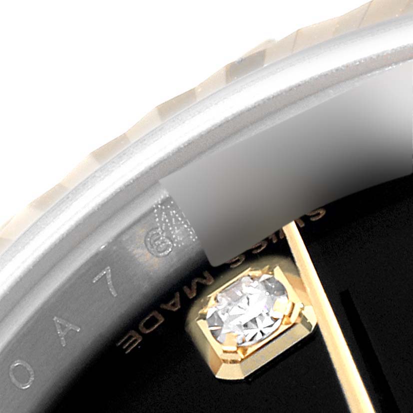 The image shows a close-up view of the bezel and dial details with a diamond marker on a Rolex Datejust 179173 Women's Steel and Gold (two tone) Black Dial 179173 Women's Steel and Gold (two tone) Black Dial watch.