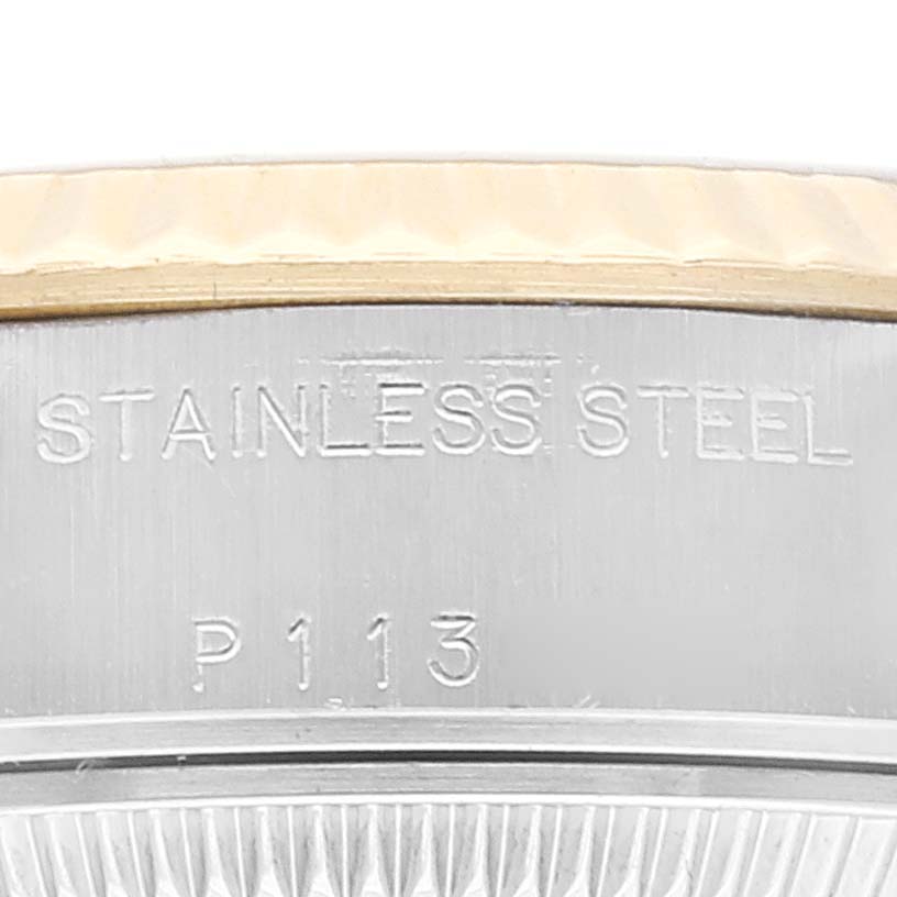 The image shows a close-up of the bezel and side of a Rolex Datejust 79173 Women's Steel and Gold (two tone) Black Dial 79173 Women's Steel and Gold (two tone) Black Dial watch, highlighting the "STAINLESS STEEL P113” engravings.