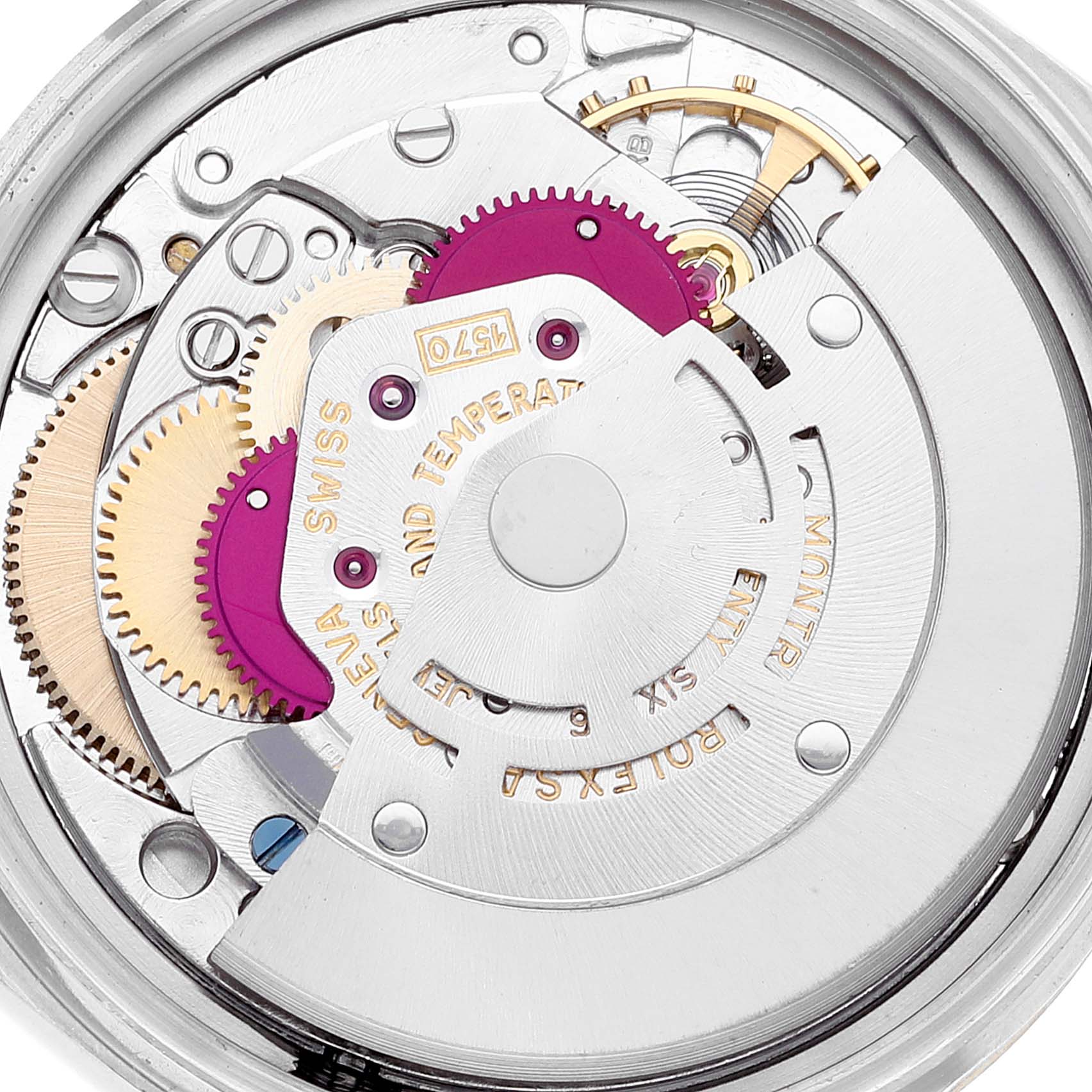 This image shows an internal view of the Rolex Vintage Collection 1601 Men's Steel and Gold (two tone) Champagne Dial 1601 Men's Steel and Gold (two tone) Champagne Dial watch, displaying its intricate movement and gears.