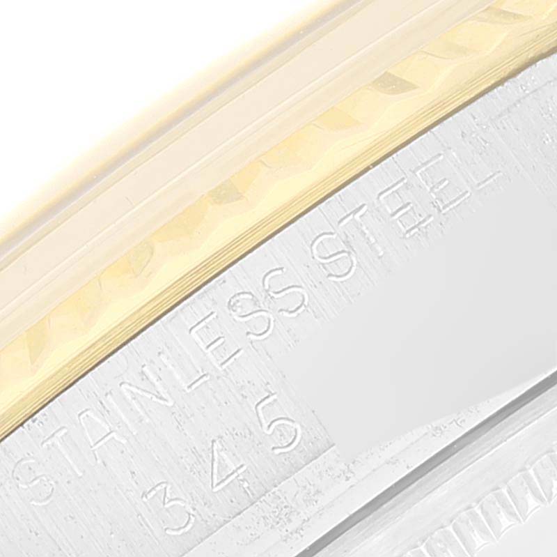 This close-up image shows the side engraving and part of the bezel of a Vintage Collection model Rolex watch.