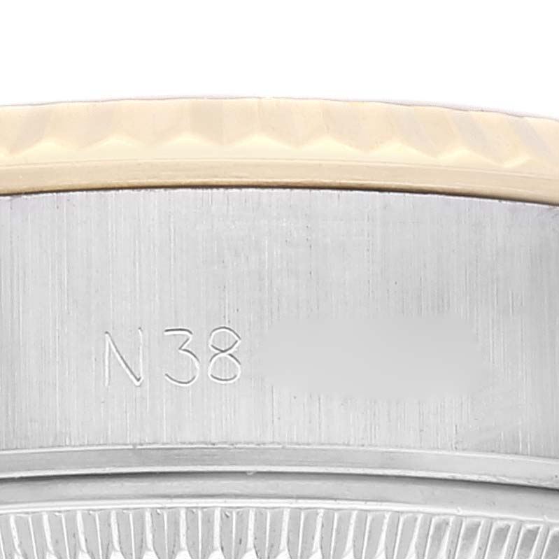 The image shows a close-up of the casing and the fluted bezel of a Rolex Datejust 69173 Women's Steel and Gold (two tone) Champagne Dial 69173 Women's Steel and Gold (two tone) Champagne Dial watch.