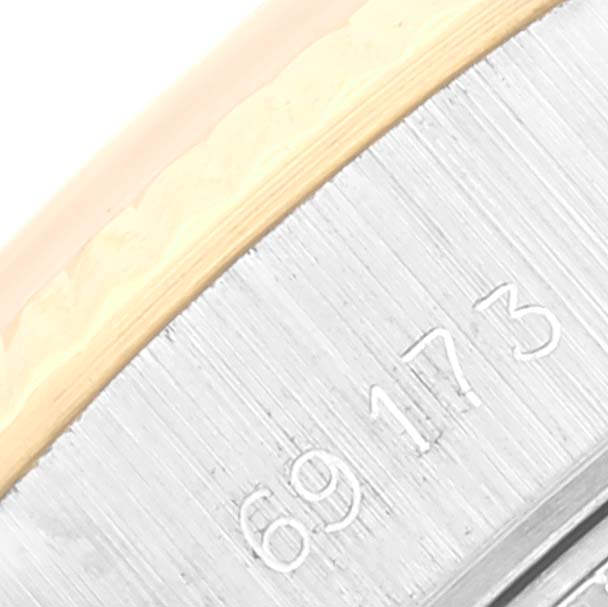 This image shows a close-up angle of the model number engraved on the bezel and case of a Rolex Datejust 69173 Women's Steel and Gold (two tone) Champagne Dial 69173 Women's Steel and Gold (two tone) Champagne Dial watch.