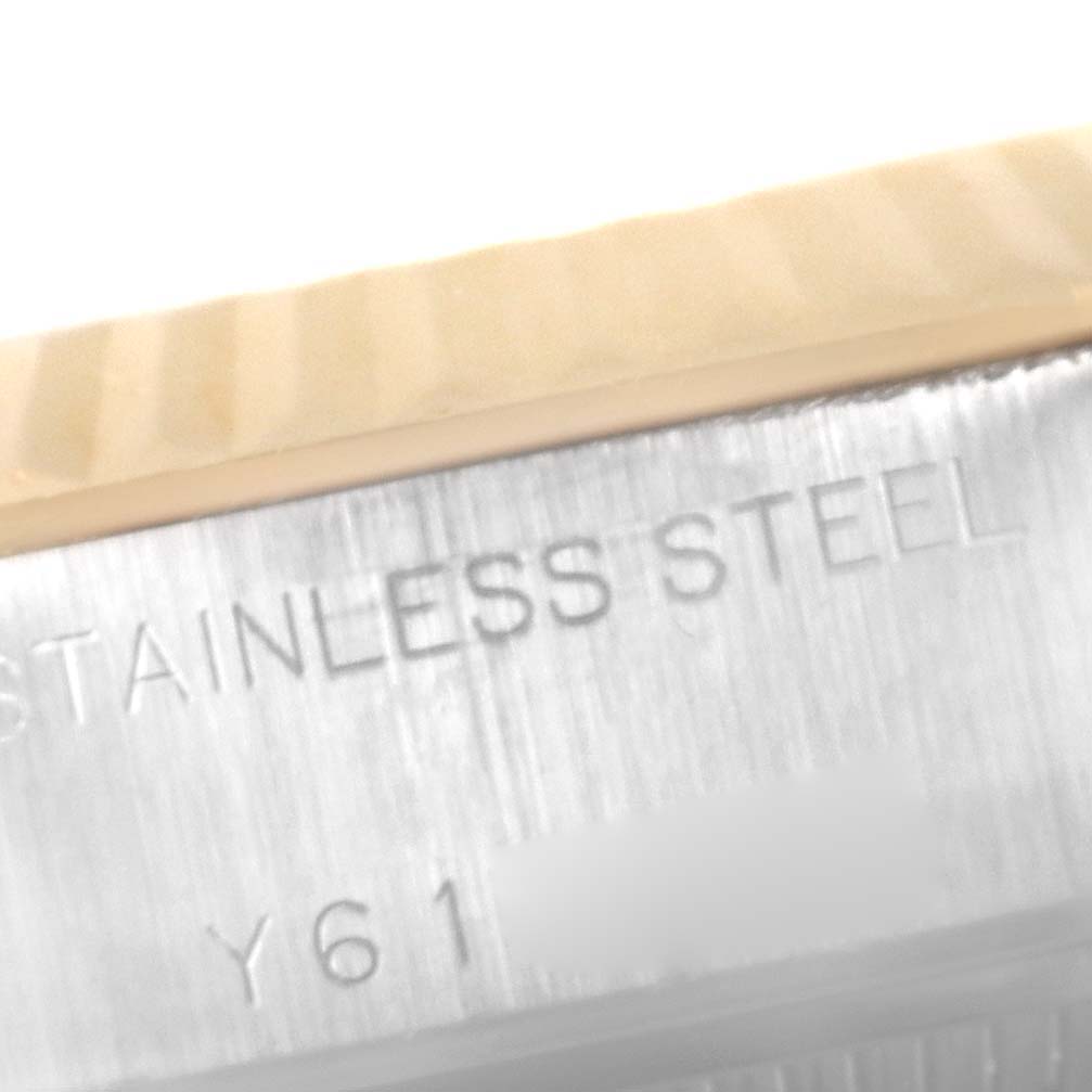 This close-up image shows the inscription on the stainless steel case of a Rolex Datejust 79173 Women's Steel and Gold (two tone) Champagne Dial 79173 Women's Steel and Gold (two tone) Champagne Dial watch.