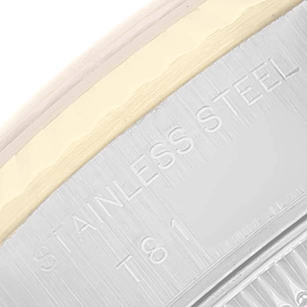 This image shows a close-up view of the outer casing of a Rolex Datejust 69173 Women's Steel and Gold (two tone) Champagne Dial 69173 Women's Steel and Gold (two tone) Champagne Dial watch, highlighting the "STAINLESS STEEL" engraving.