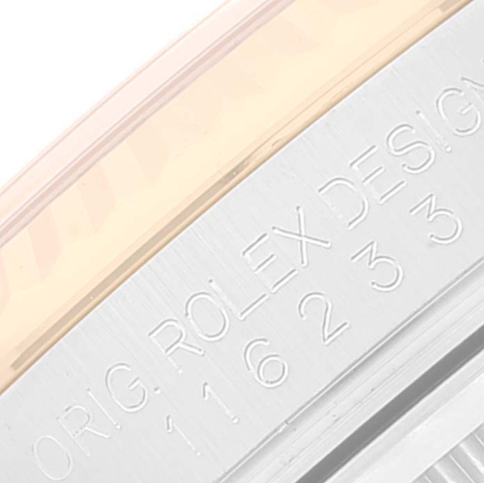 This is a close-up view of the Datejust model by Rolex, showing the engraved model number and design details on the side of the watch case.