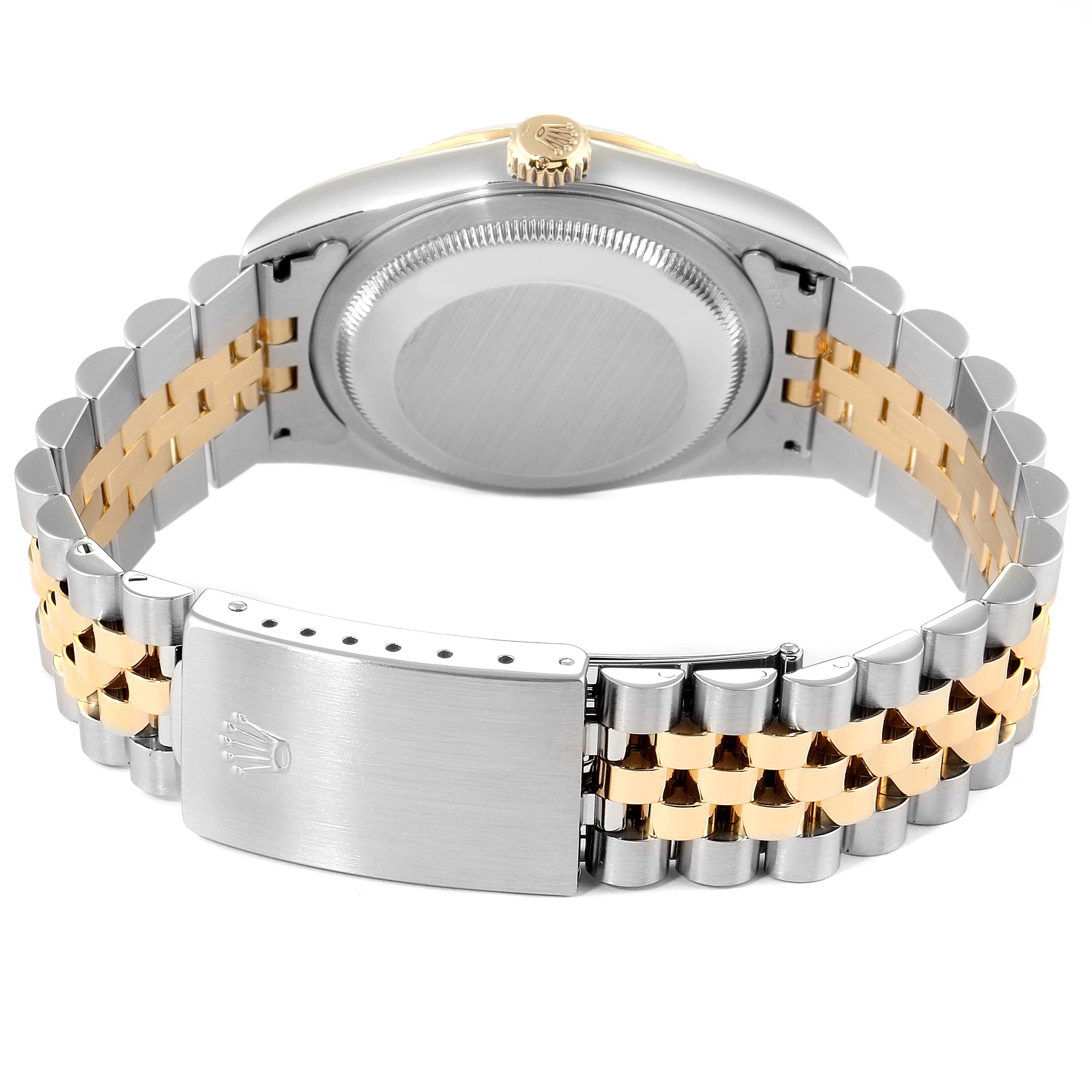 The image shows the backside of a Rolex Datejust 16233 Men's Steel and Gold (two tone) White Dial 16233 Men's Steel and Gold (two tone) White Dial watch, highlighting its bi-metal bracelet and clasp.