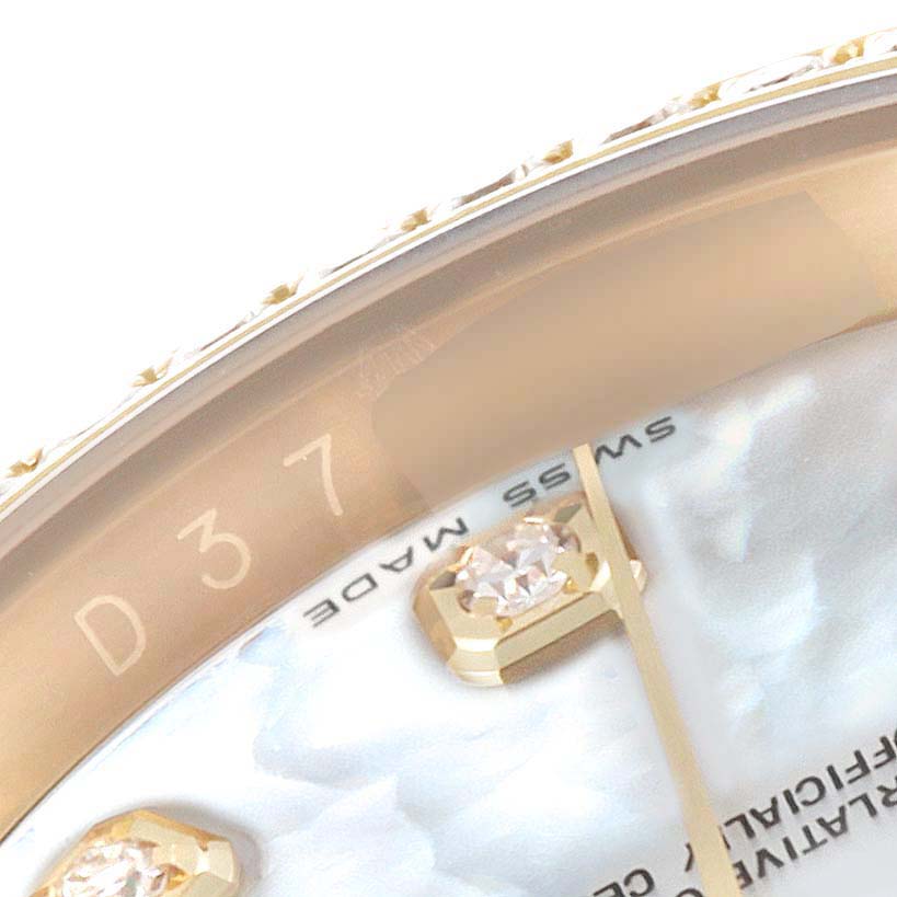 This image shows a close-up view of the bezel and part of the dial with diamond markers on a Rolex Datejust 116188 Men's Yellow Gold Mother of Pearl Dial 116188 Men's Yellow Gold Mother of Pearl Dial watch.