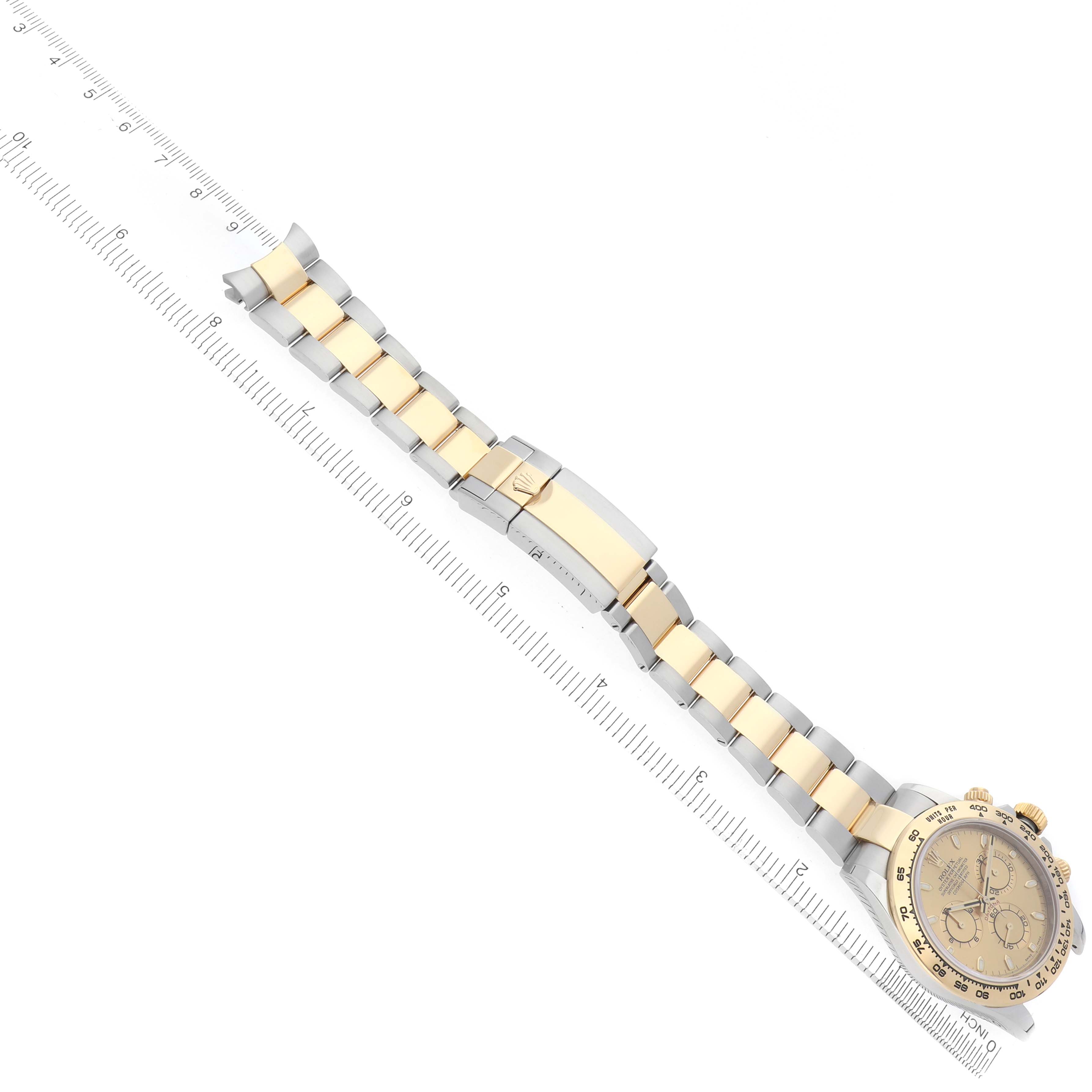This image shows a Rolex Daytona 116503 Men
s Steel and Gold (two tone) Champagne Dial watch with a focus on the dial, bracelet, and clasp, aligned alongside a measuring ruler.