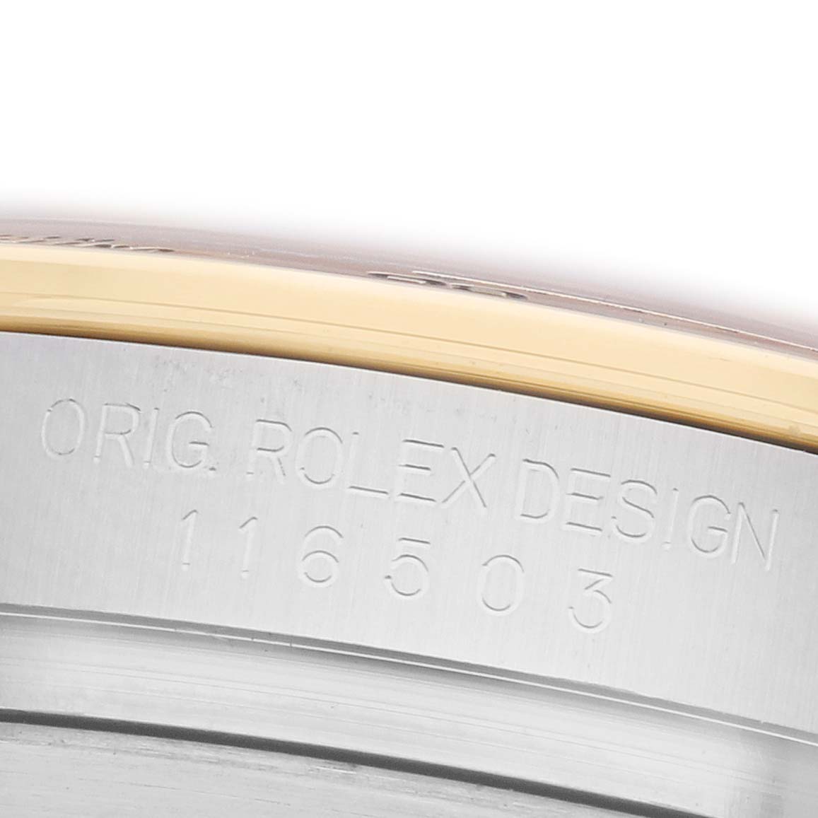 The image shows a close-up of the side edge with engraving on the Rolex Daytona 116503 Men
s Steel and Gold (two tone) Champagne Dial watch.
