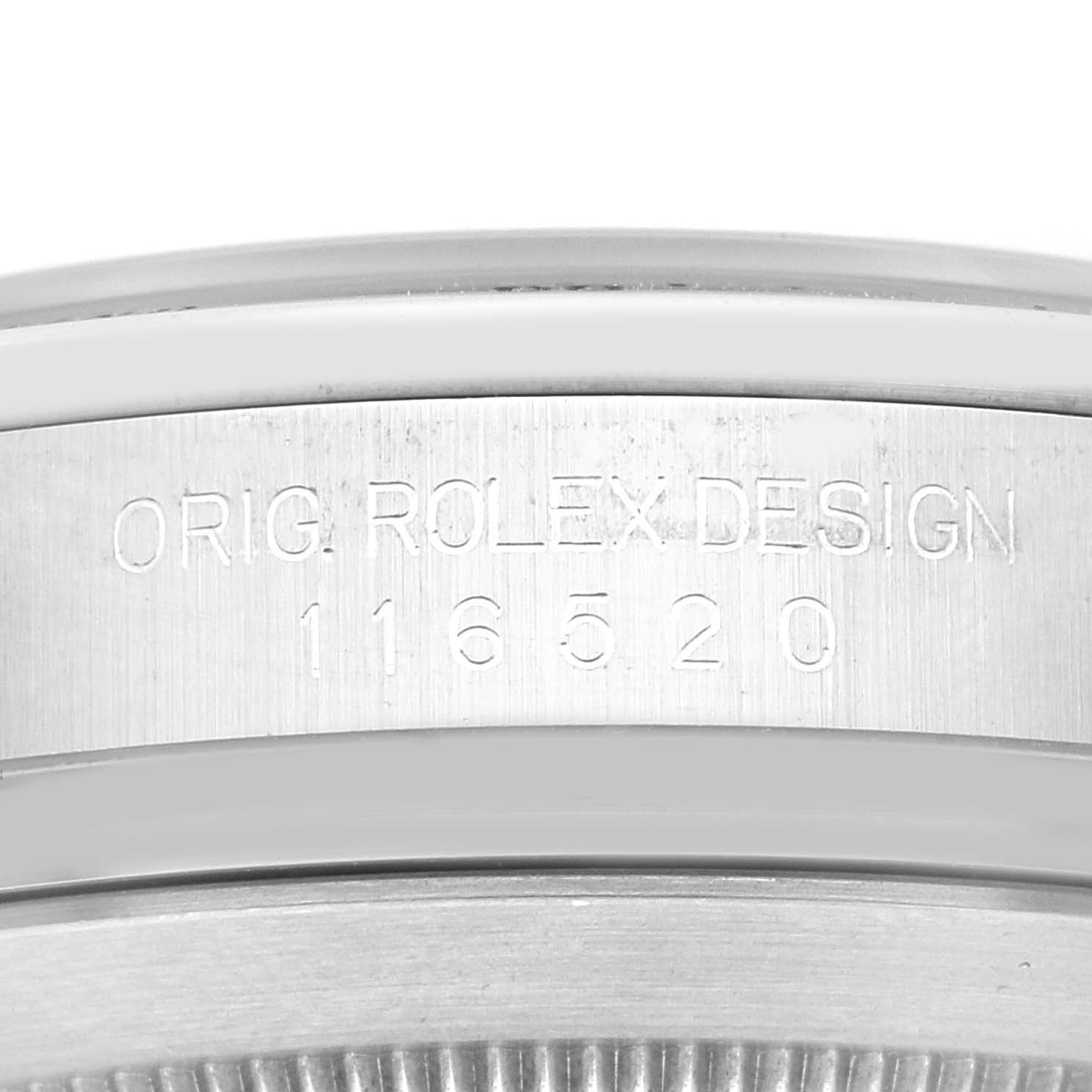 The image shows the engraving on the side of the bezel of a Rolex Daytona 116520 Men
s Stainless Steel Black Dial, focusing on model number 116520.