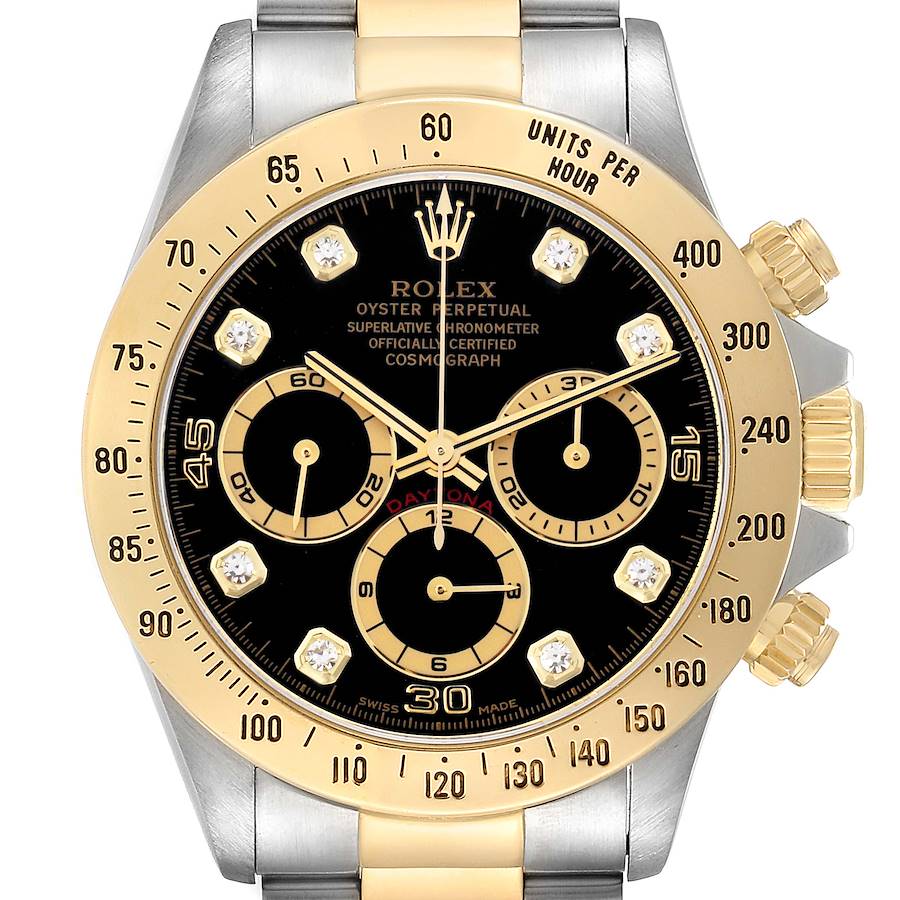The image shows a front view of the Rolex Daytona 16523 Men's Steel and Gold (two tone) Black Dial watch featuring a black dial, gold bezel, and chronograph subdials.