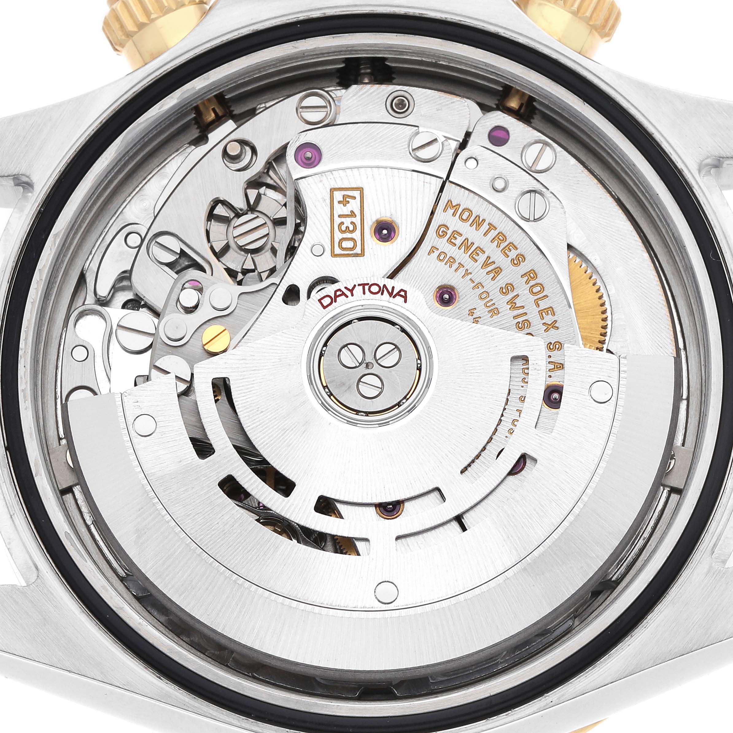 The image shows the intricate movement mechanism of a Rolex Daytona 116523 Men
s Steel and Gold (two tone) Champagne Dial watch from a rear angle.