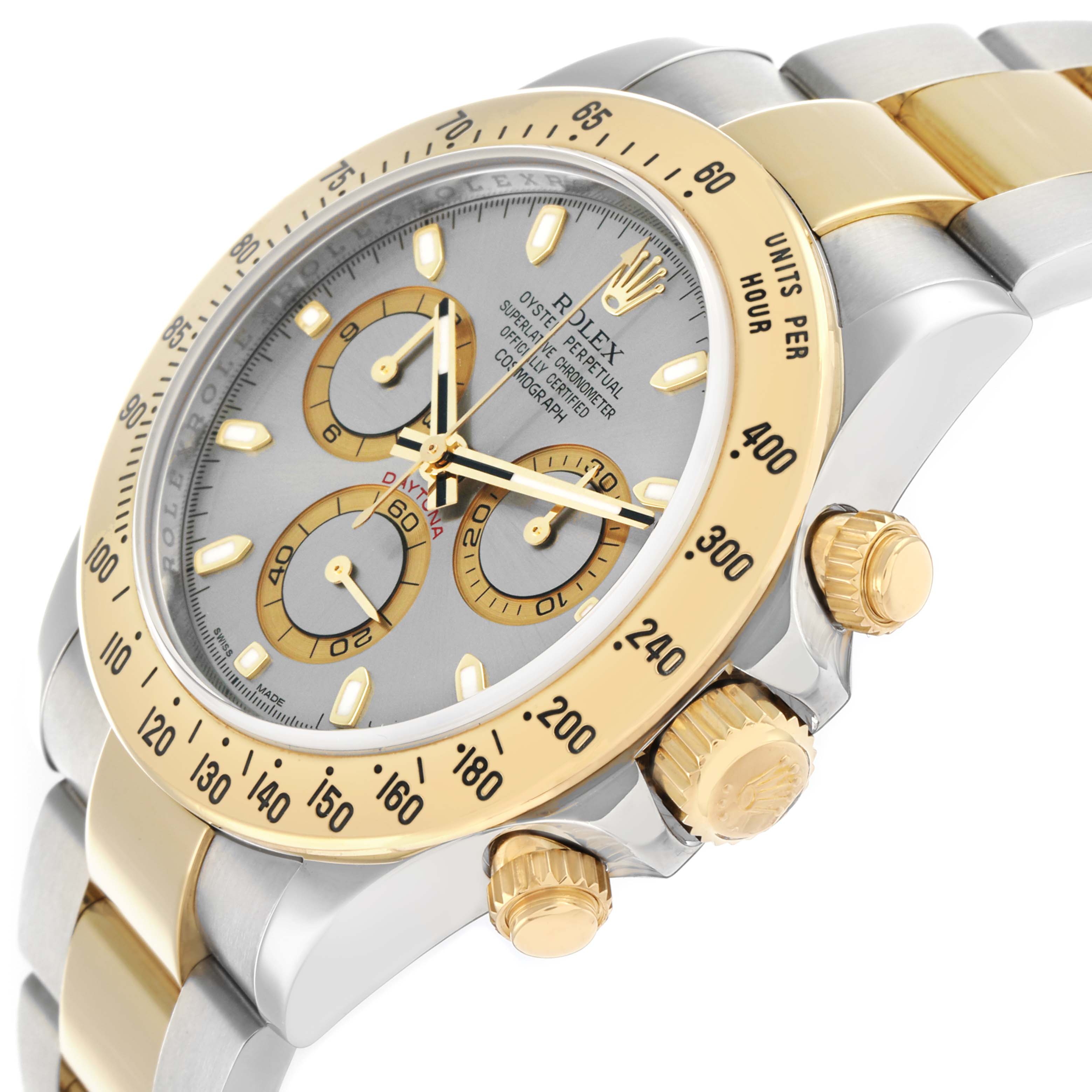 The Rolex Daytona 116523 Men
s Steel and Gold (two tone) Silver Dial watch is shown at a close-up angle highlighting the bezel, dial, crown, and chronograph pushers.