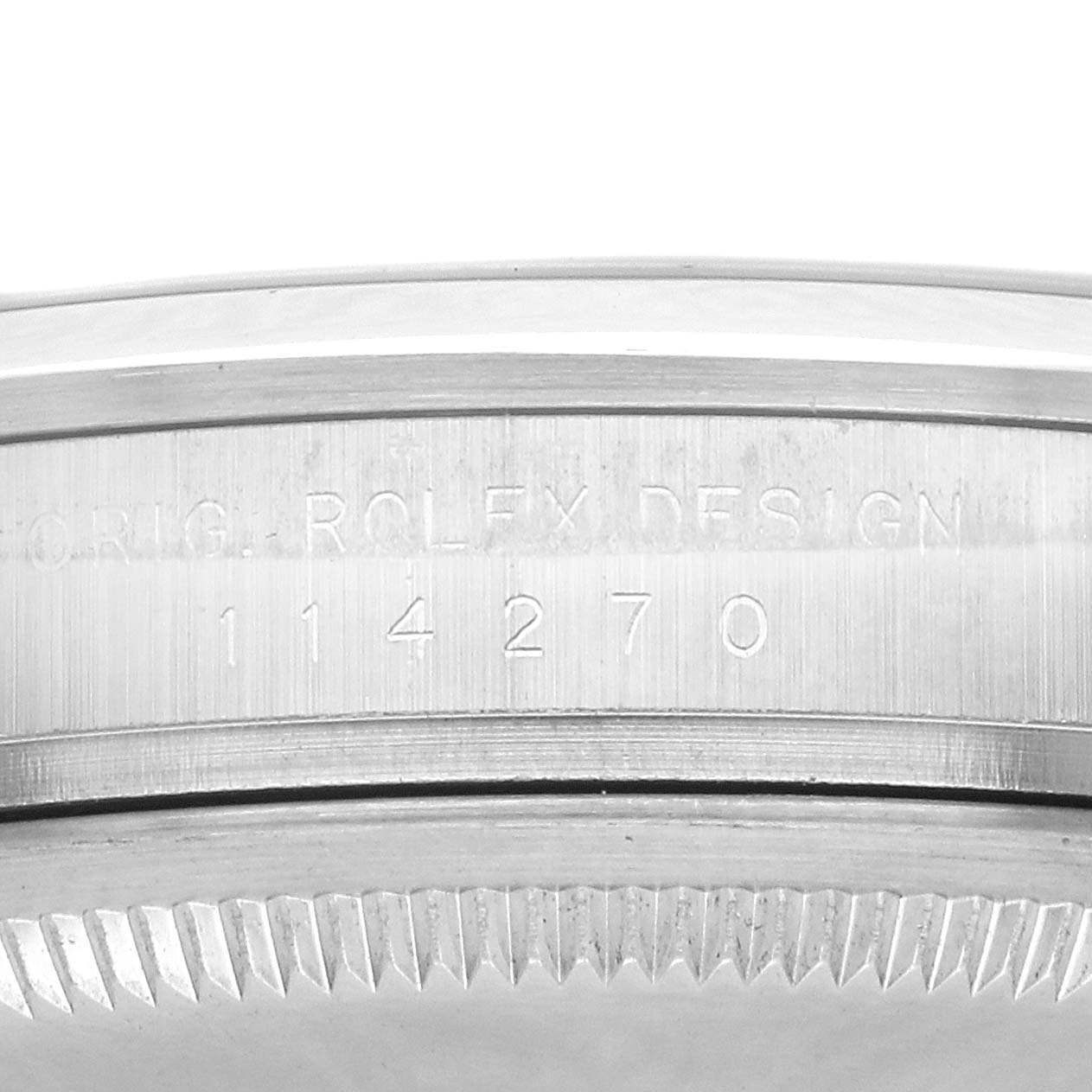 The image shows the case side engraving of the Rolex Explorer 114270 Men
s Stainless Steel Black Dial model, displaying the model number and details.
