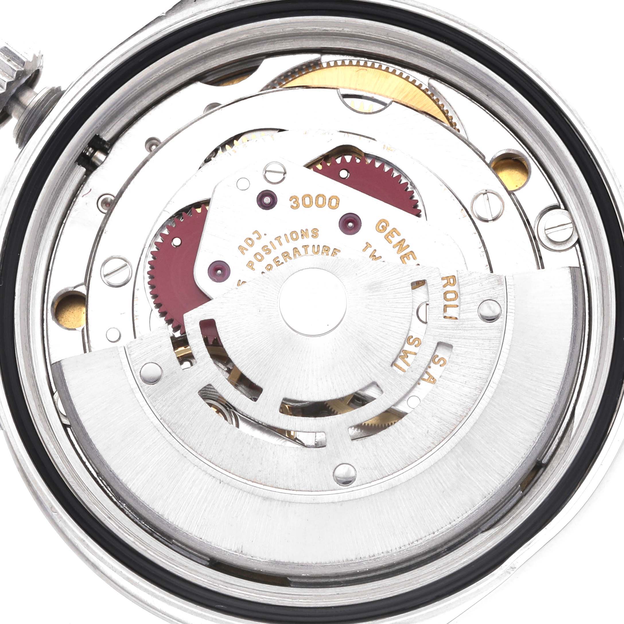 The image shows the inner movement of a Rolex Explorer 14270 Men
s Stainless Steel Black Dial watch, viewed from the back, highlighting gears and intricate components.