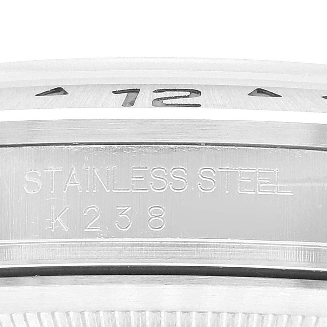 This image shows a close-up of the side of the stainless steel case of a Rolex Explorer 16570 Men
s Stainless Steel Black Dial 16570 Men
s Stainless Steel Black Dial watch.
