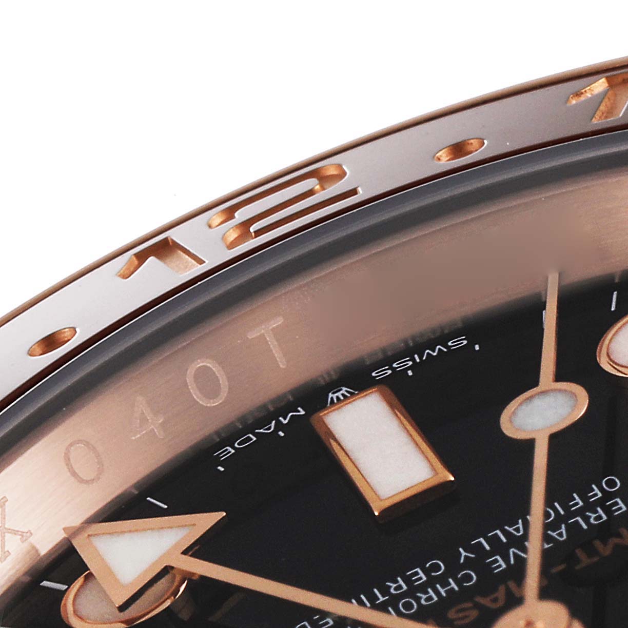 Close-up angled view of a Rolex GMT-Master 126715 Men's Rose Gold Black Dial 126715 Men's Rose Gold Black Dial watch, showing the bezel, part of the dial, and hands.