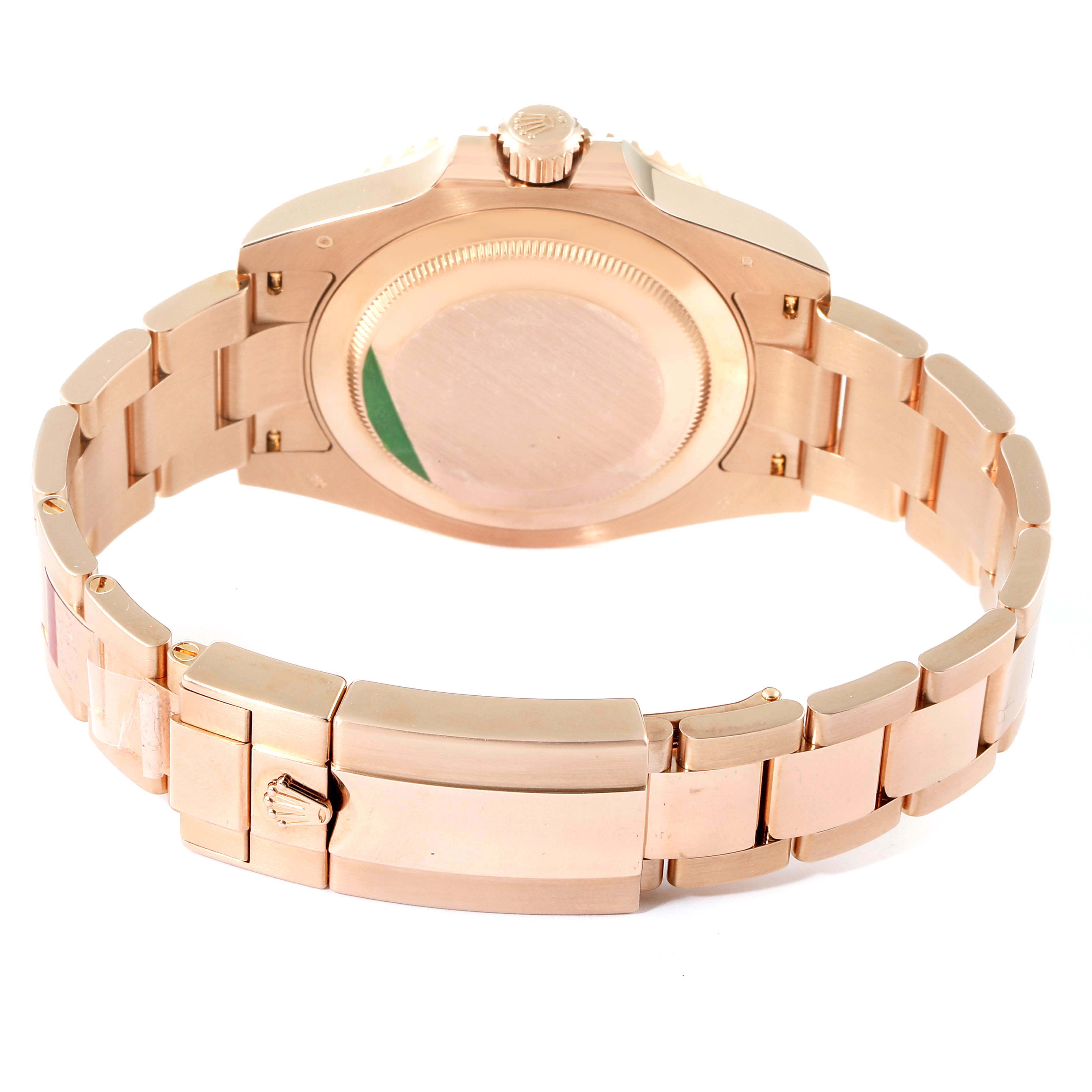 The image shows the back case and bracelet of a Rolex GMT-Master 126715 Men's Rose Gold Black Dial 126715 Men's Rose Gold Black Dial watch in a gold finish from a rear angle.