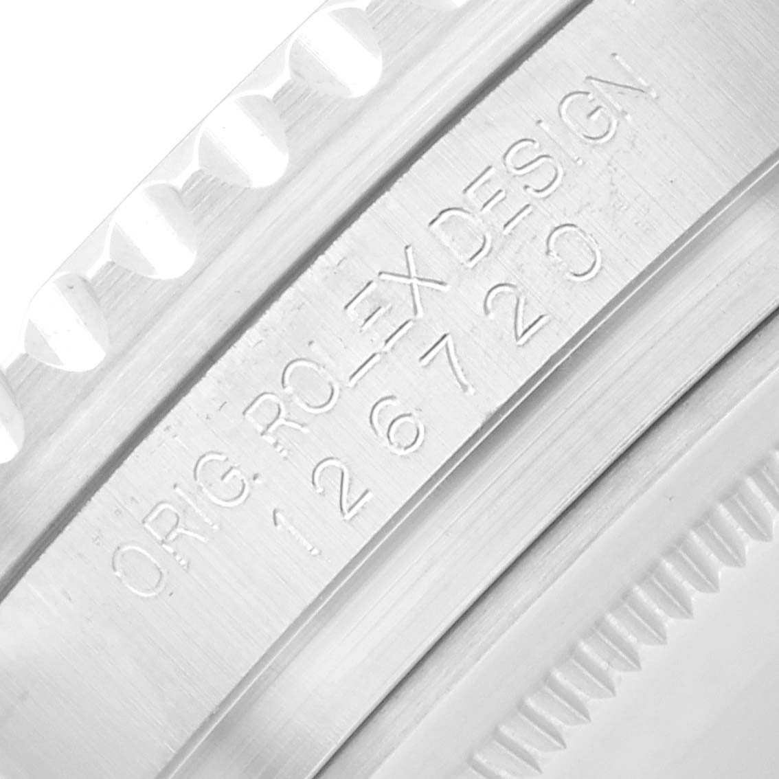 The image shows a close-up of the Rolex GMT-Master 126720 Men
s Stainless Steel Black Dial
s side, focusing on the bezel with engraved branding details.