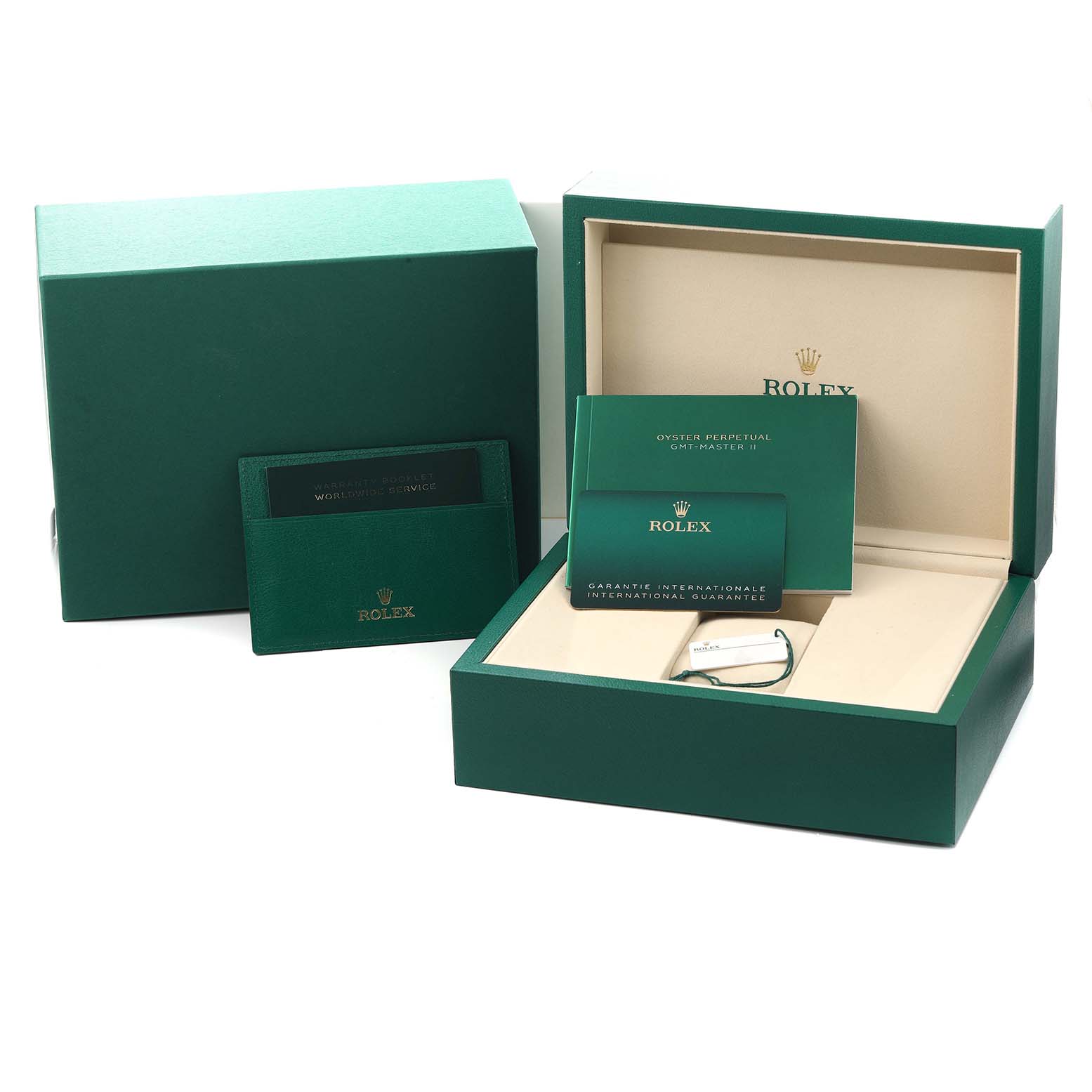 The image shows the packaging, warranty cards, and manuals for the Rolex GMT-Master 126729 Men
s White Gold Green Dial watch, viewed from the front.