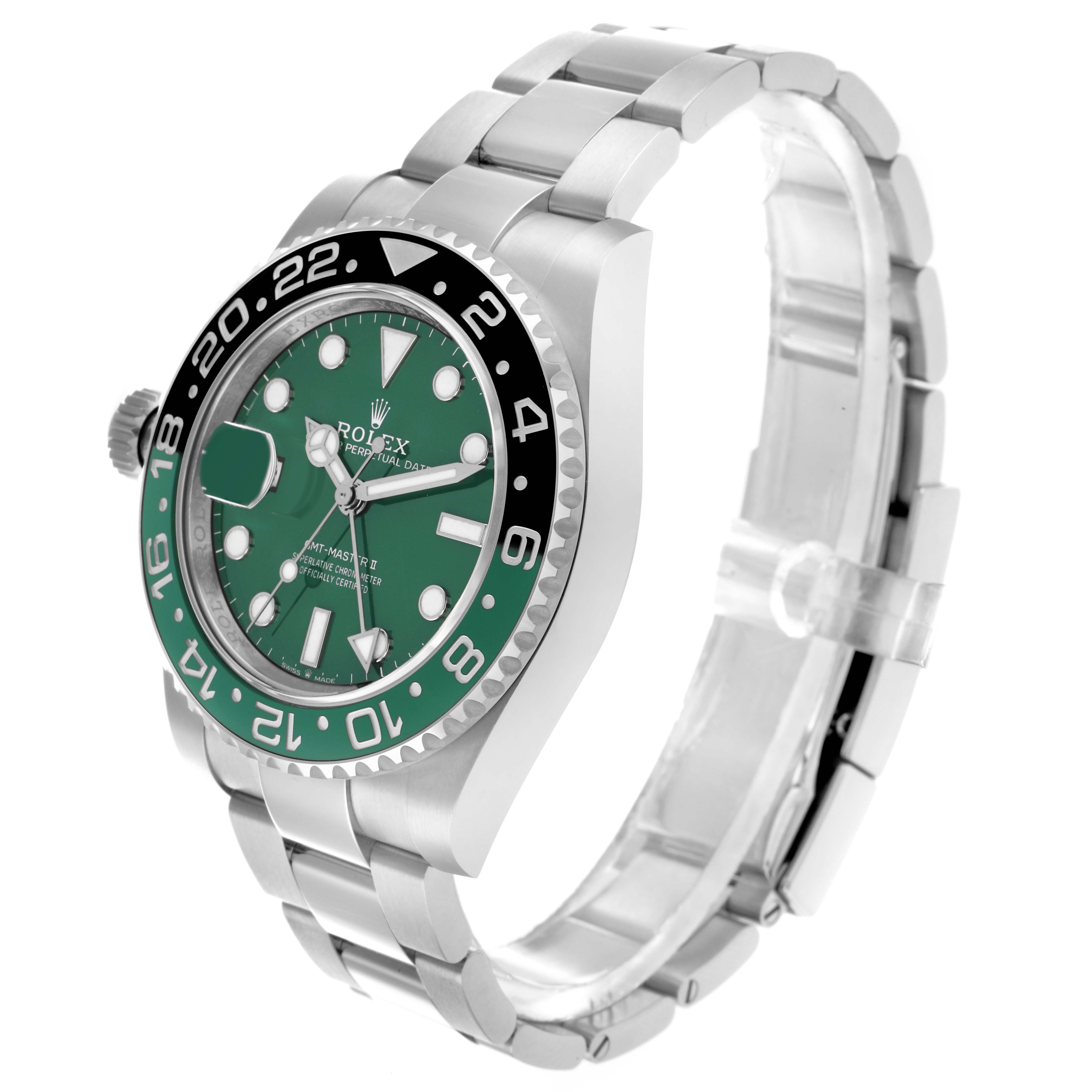 The Rolex GMT-Master 126729 Men
s White Gold Green Dial watch is shown at a three-quarter angle displaying the dial, bezel, crown, and a portion of the bracelet.
