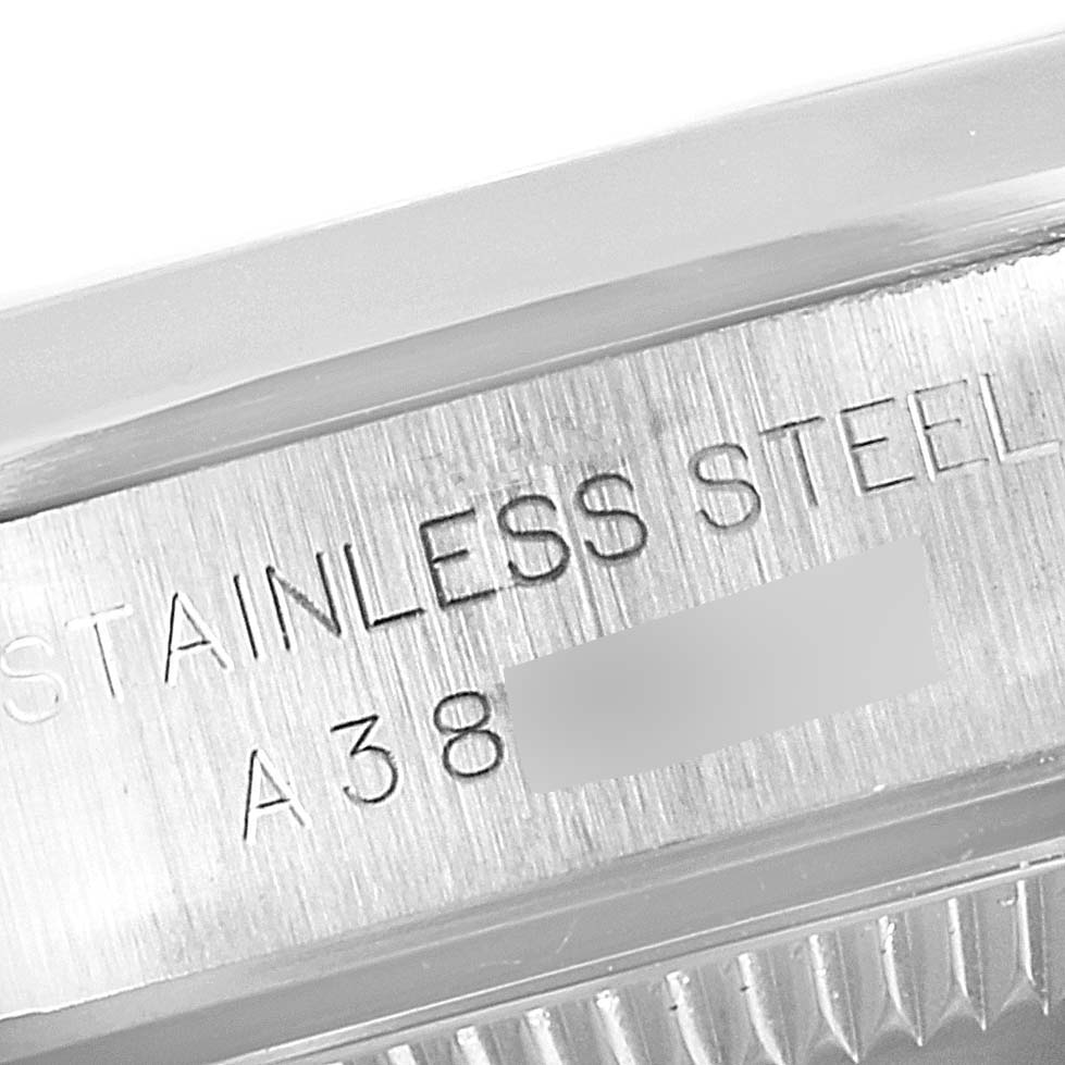 This image shows a close-up angle of the case with engraved text indicating "STAINLESS STEEL" on a Rolex Oyster Perpetual 76080 Women
s Stainless Steel Blue Dial 76080 Women
s Stainless Steel Blue Dial model.
