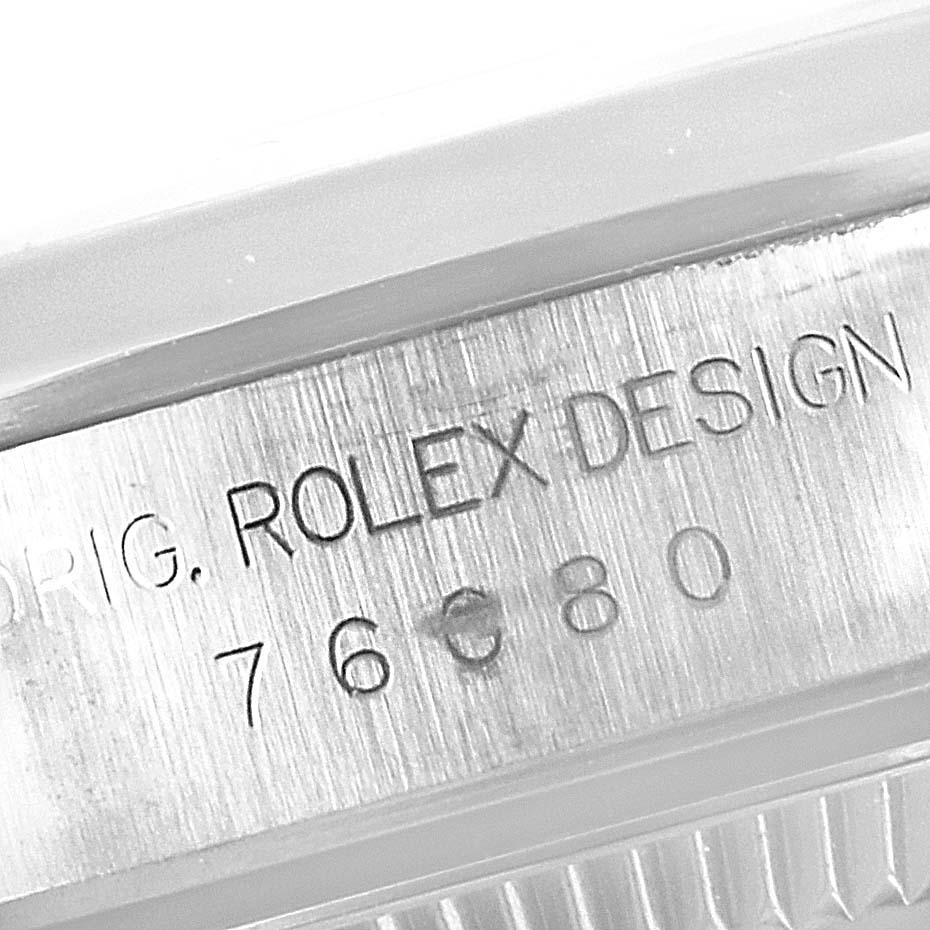 This close-up angle shows the serial number engraved on the side of the case of a Rolex Oyster Perpetual 76080 Women
s Stainless Steel Blue Dial 76080 Women
s Stainless Steel Blue Dial watch.