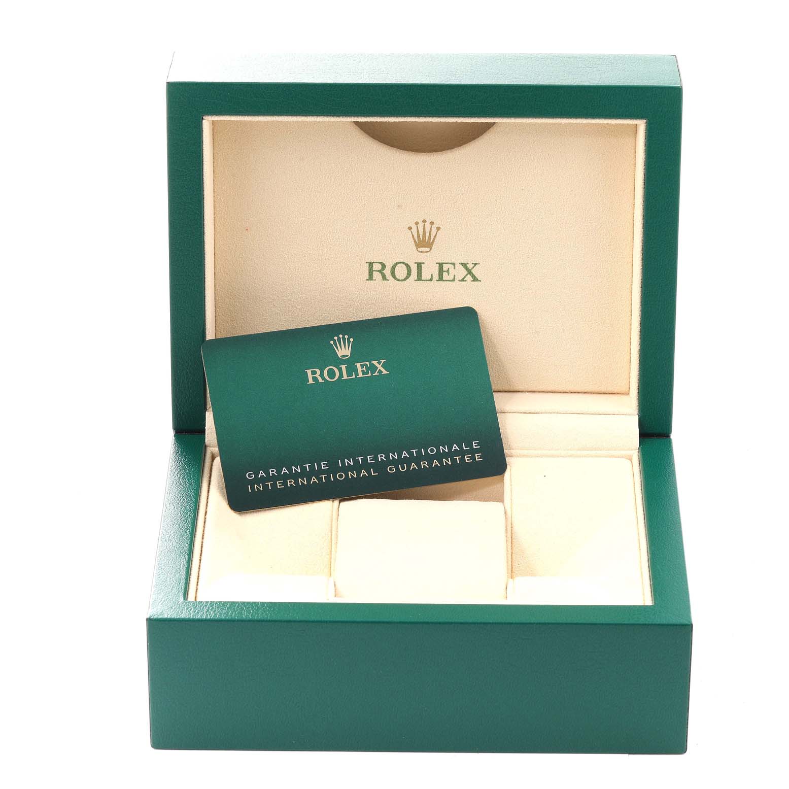 The image shows a green Rolex box with an international guarantee card for an Oyster Perpetual model.