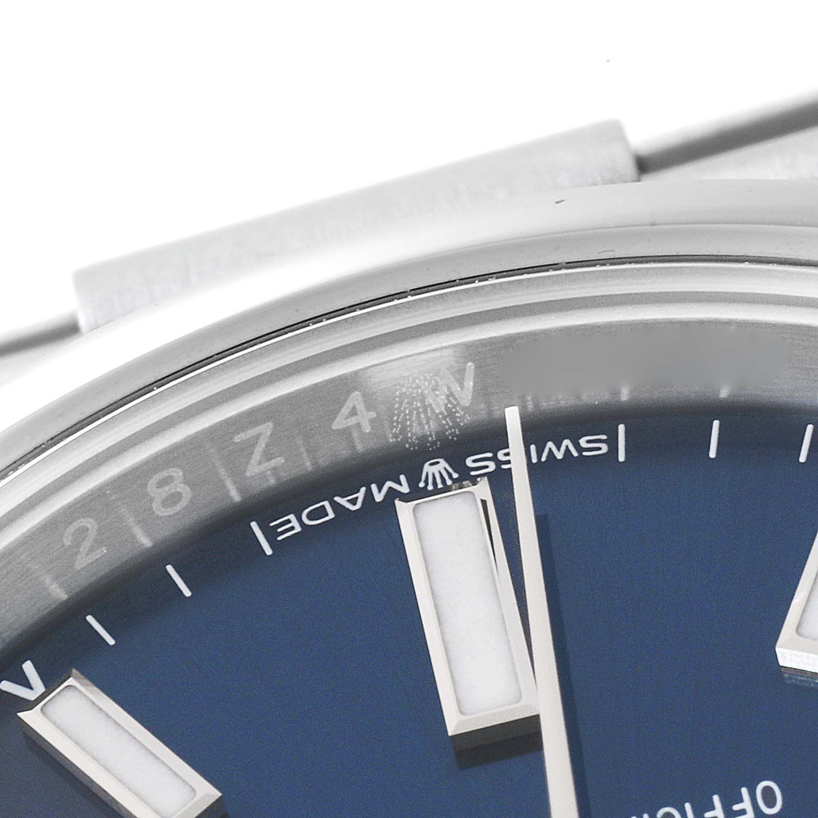 This close-up shows the dial and portion of the bezel of the Rolex Oyster Perpetual 124200 Men's Stainless Steel Blue Dial 124200 Men's Stainless Steel Blue Dial watch.